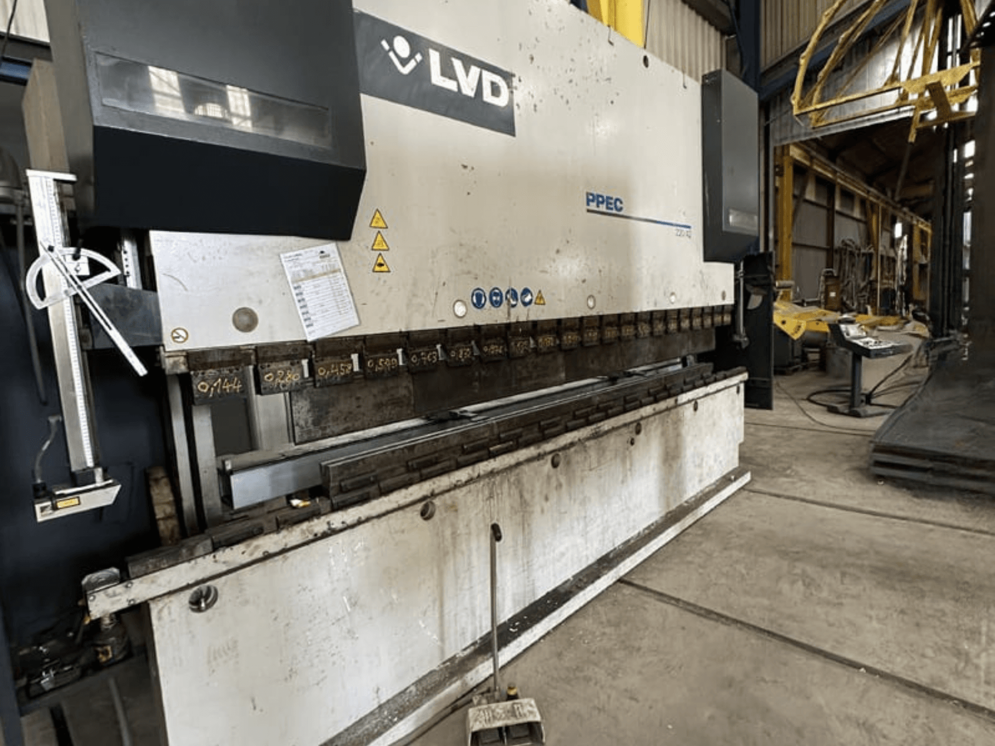 LVD PPEC 220/42 press brake in side view with a control panel and measurement markings visible on the machine.