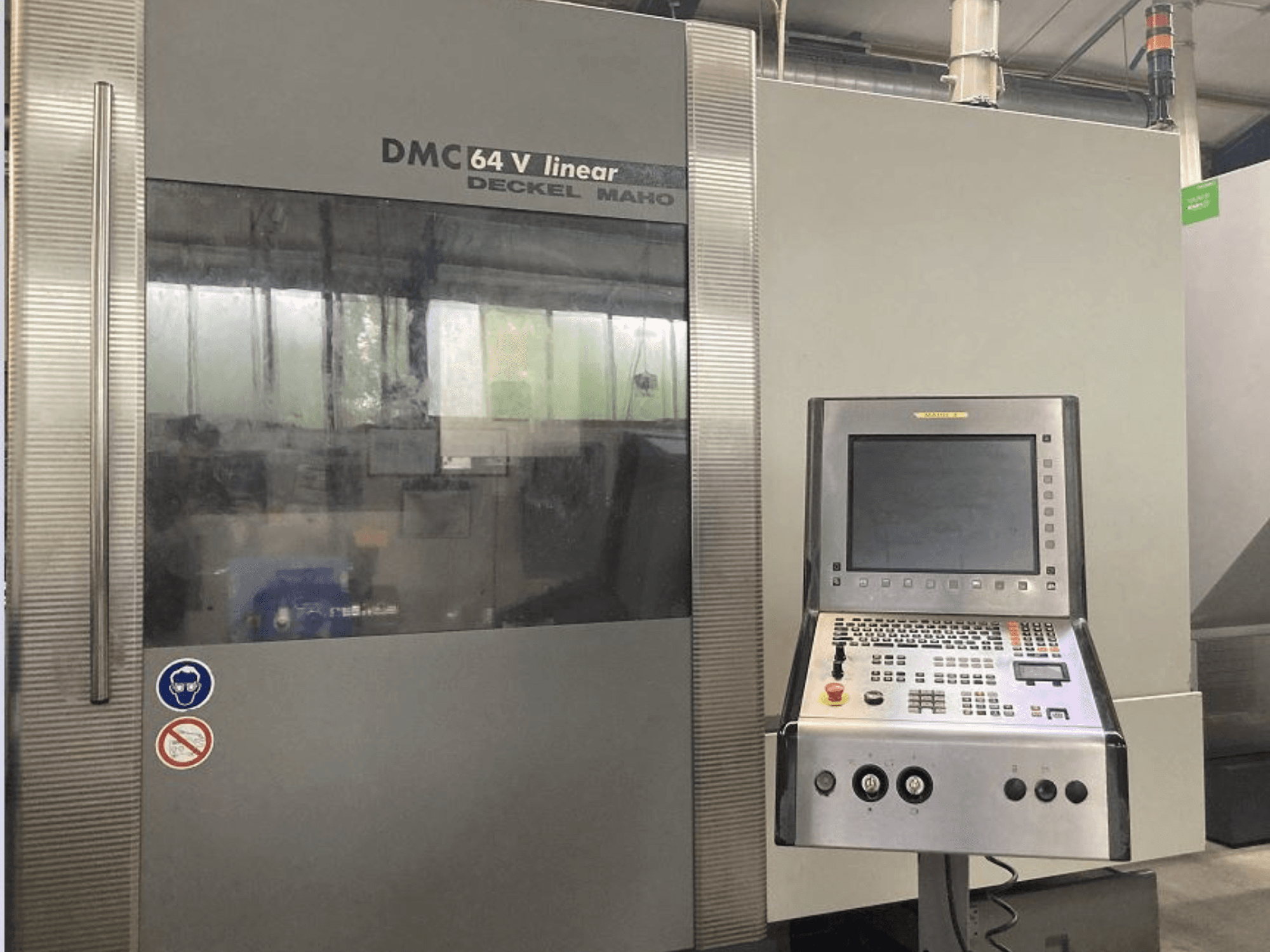 DMG DECKEL MAHO DMC 64V linear vertical machining centre, front view showing control panel and display.