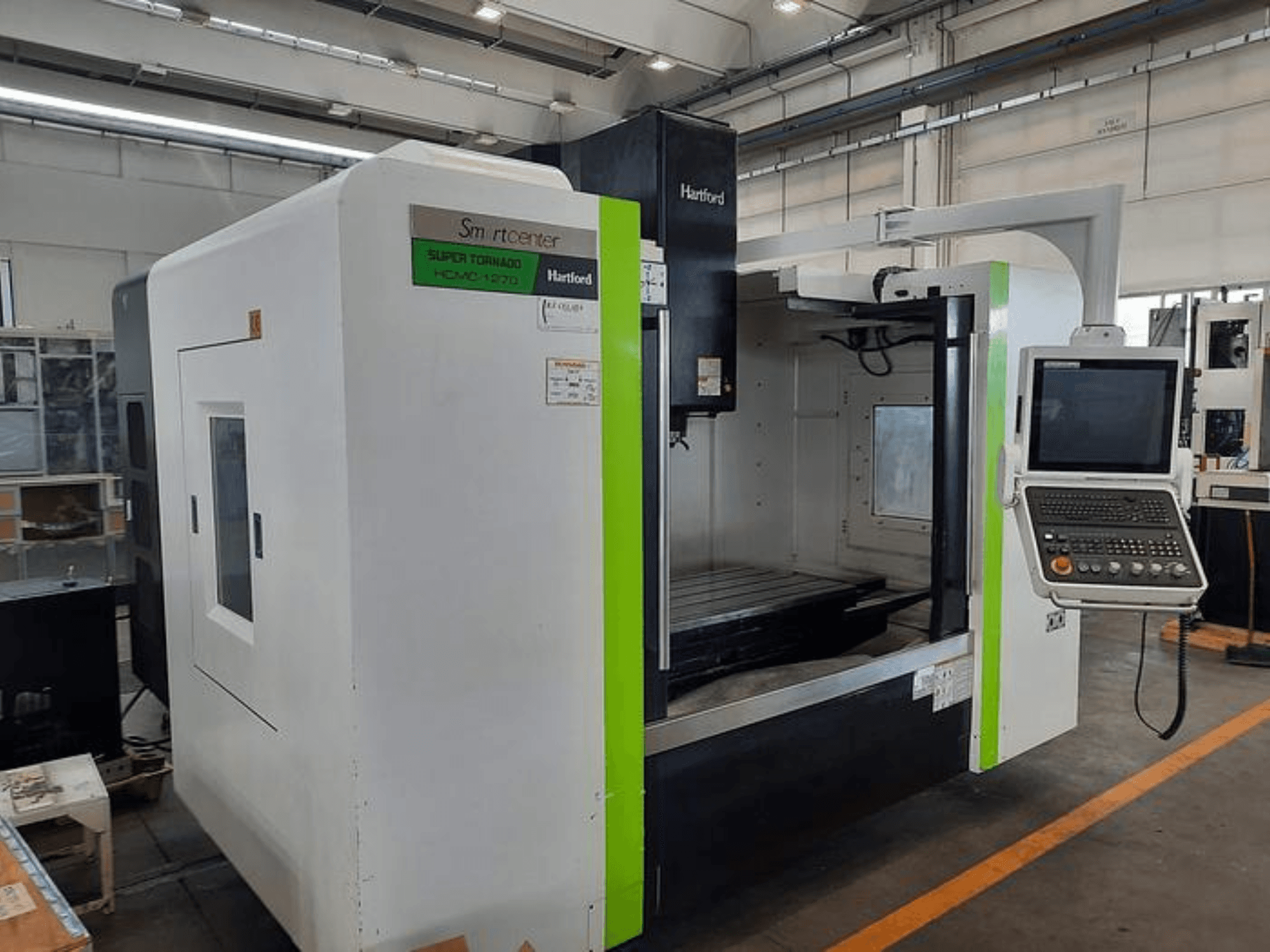 Hartford Super Tornado HCM-1270 CNC machine, front view, displaying control panel and open work area.