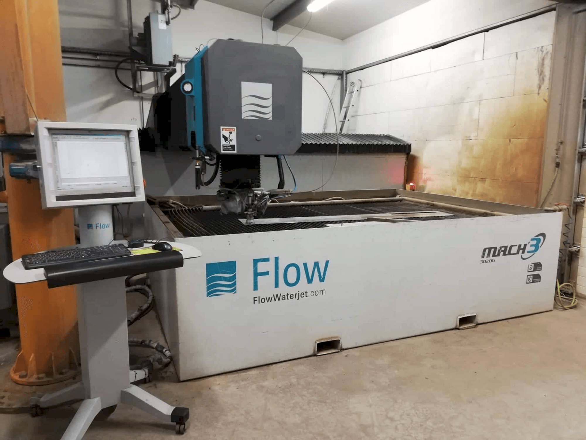 Front view of Flow Mach3-3020b machine