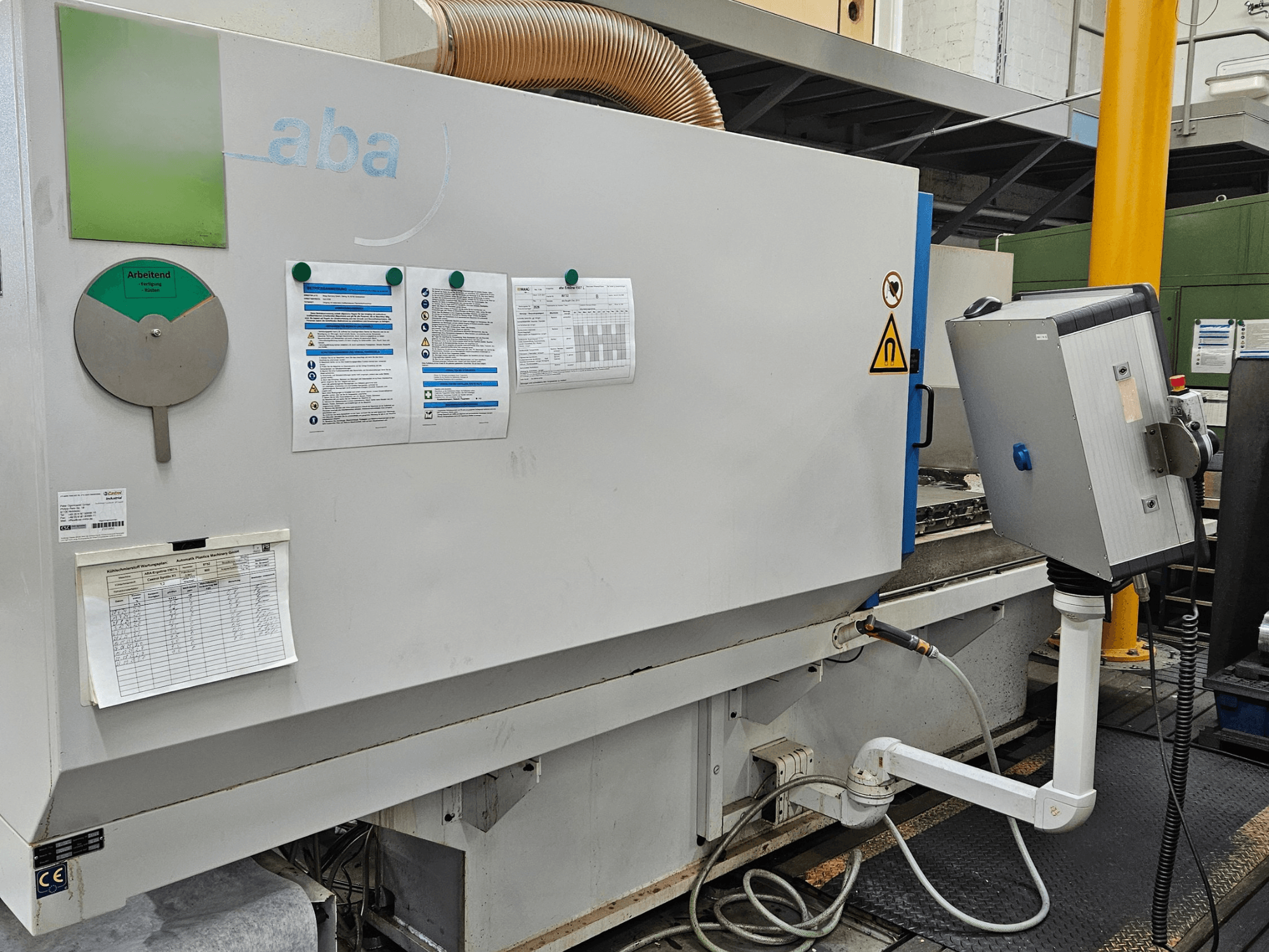 Front view of ABA ECOLINE 1507 surface grinding machine with control panel, safety warnings, and operational guidelines visible.