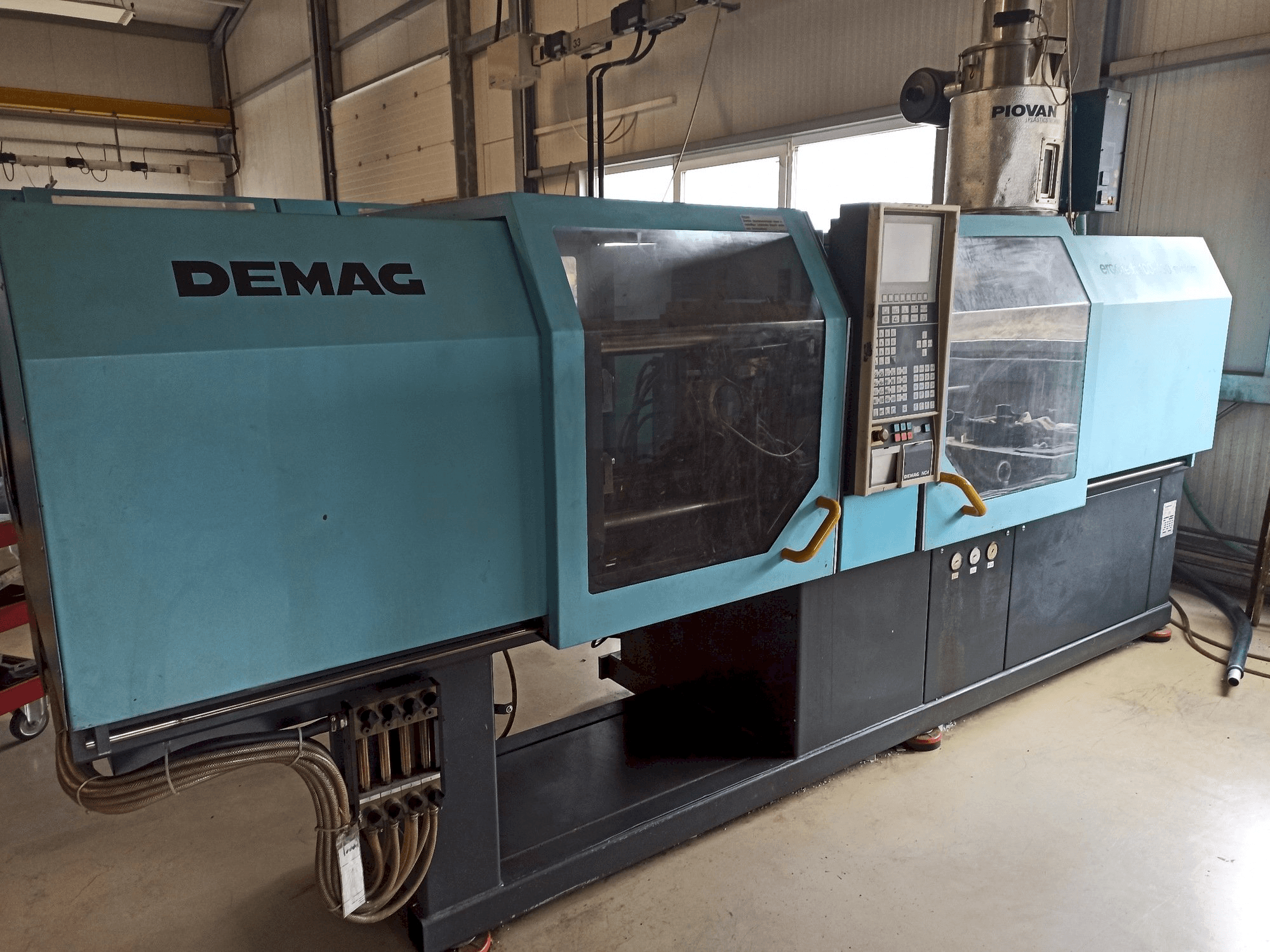 Left side view of DEMAG Ergotech 150-610 Compact machine