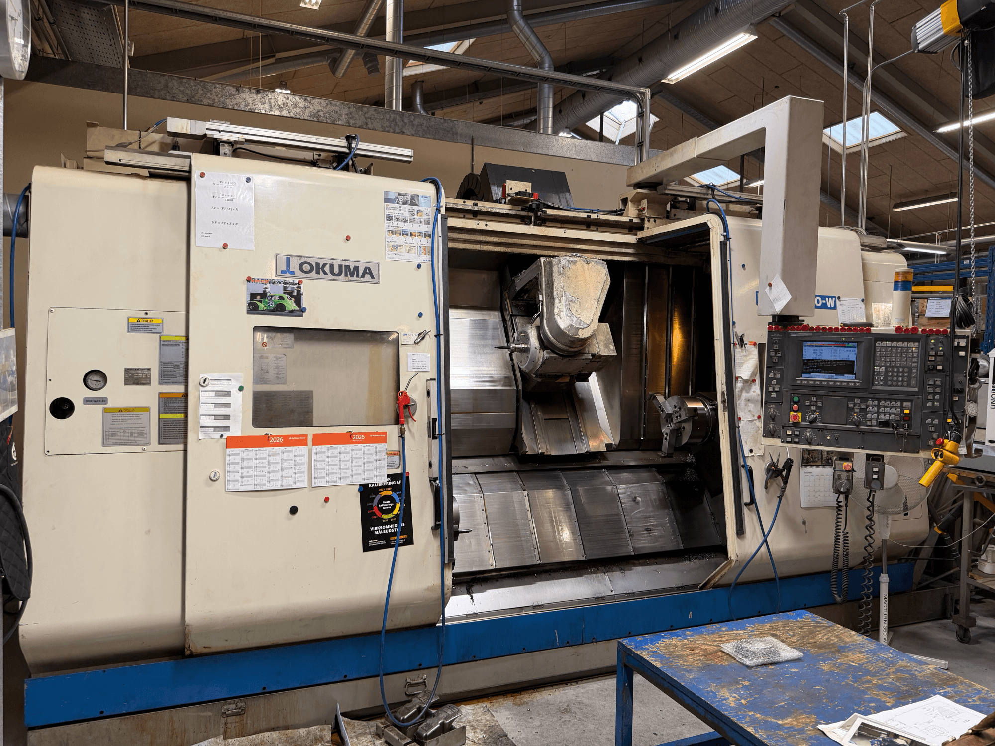 Okuma MacTurn350-W turn-mill centre, front view showcasing control panel and open access to machining area.
