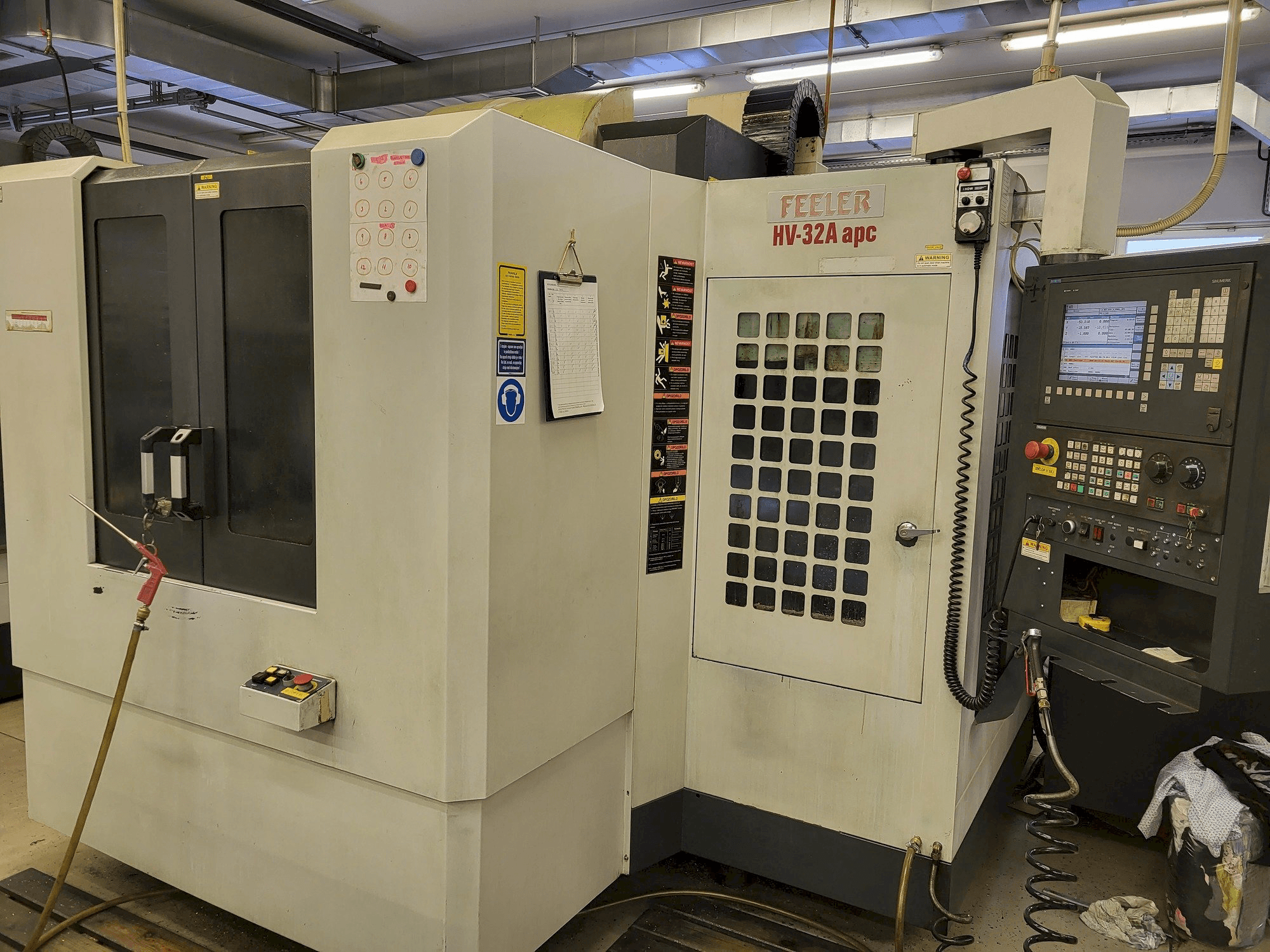 Front view of Feeler HV-32A-APC machine