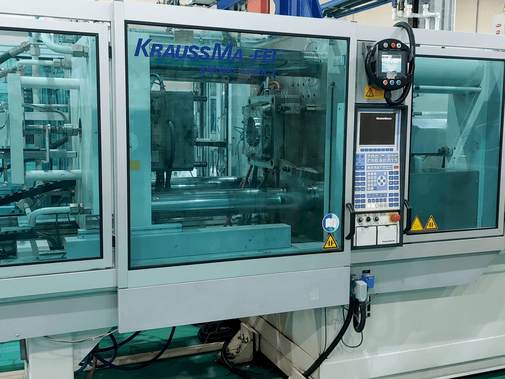 Front view of Krauss Maffei 300 – 1400 C2 machine