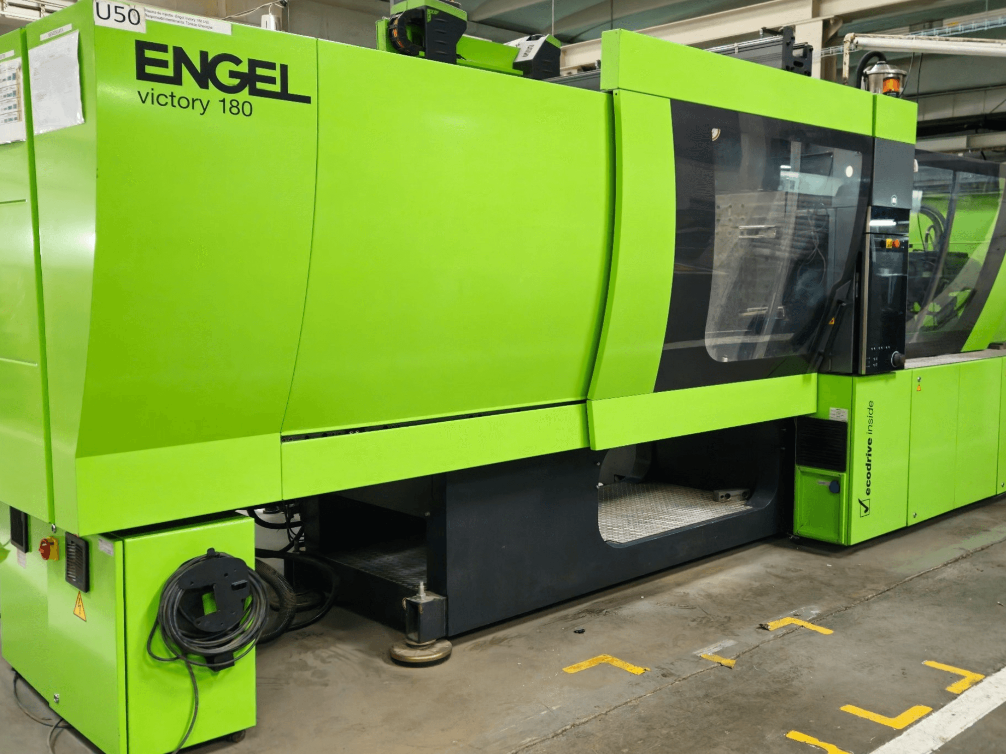 ENGEL Victory 180 injection molding machine in bright green, front view showing control panel and large viewing window.