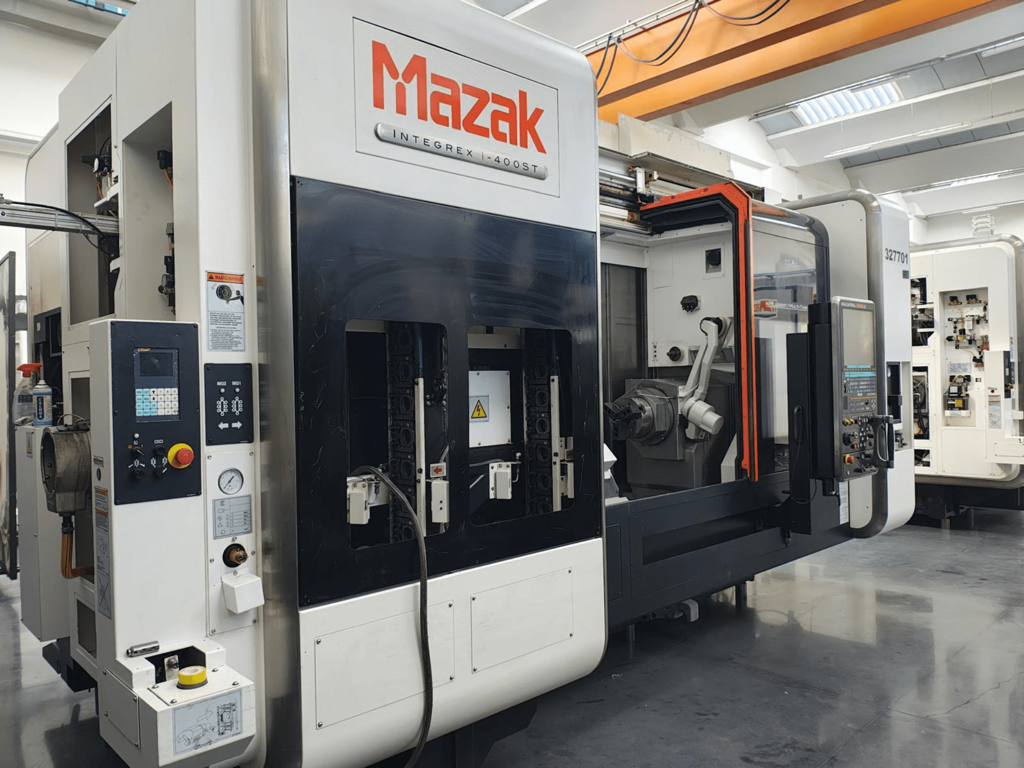 Mazak Integrex 400ST, front view; CNC machine with control panel, spindles, and robotic arm visible in a workshop setting.