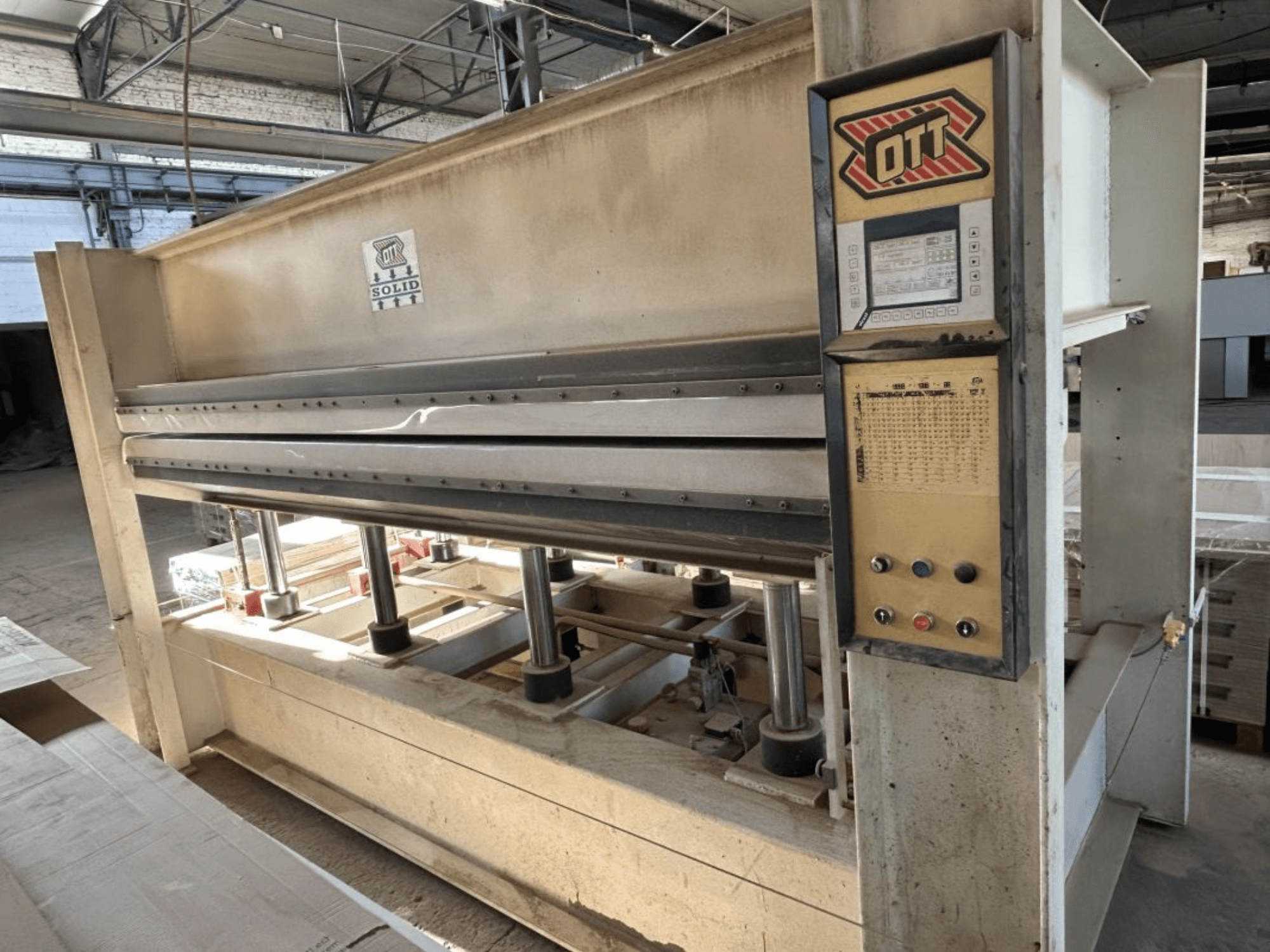 Front view of OTT SOLID 16-32 laminating press, showing control panel and hydraulic components.