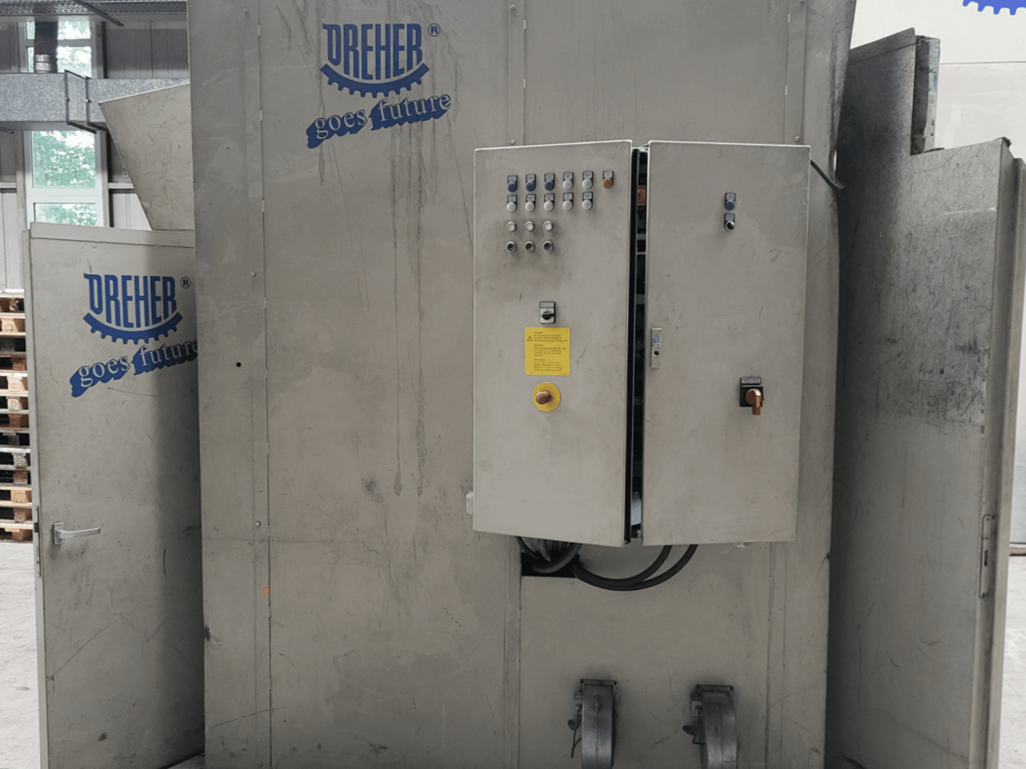 DREHER S 42/65 GFS-15 GR plastic processing machine, front view showing control panel and branding, industrial setting.