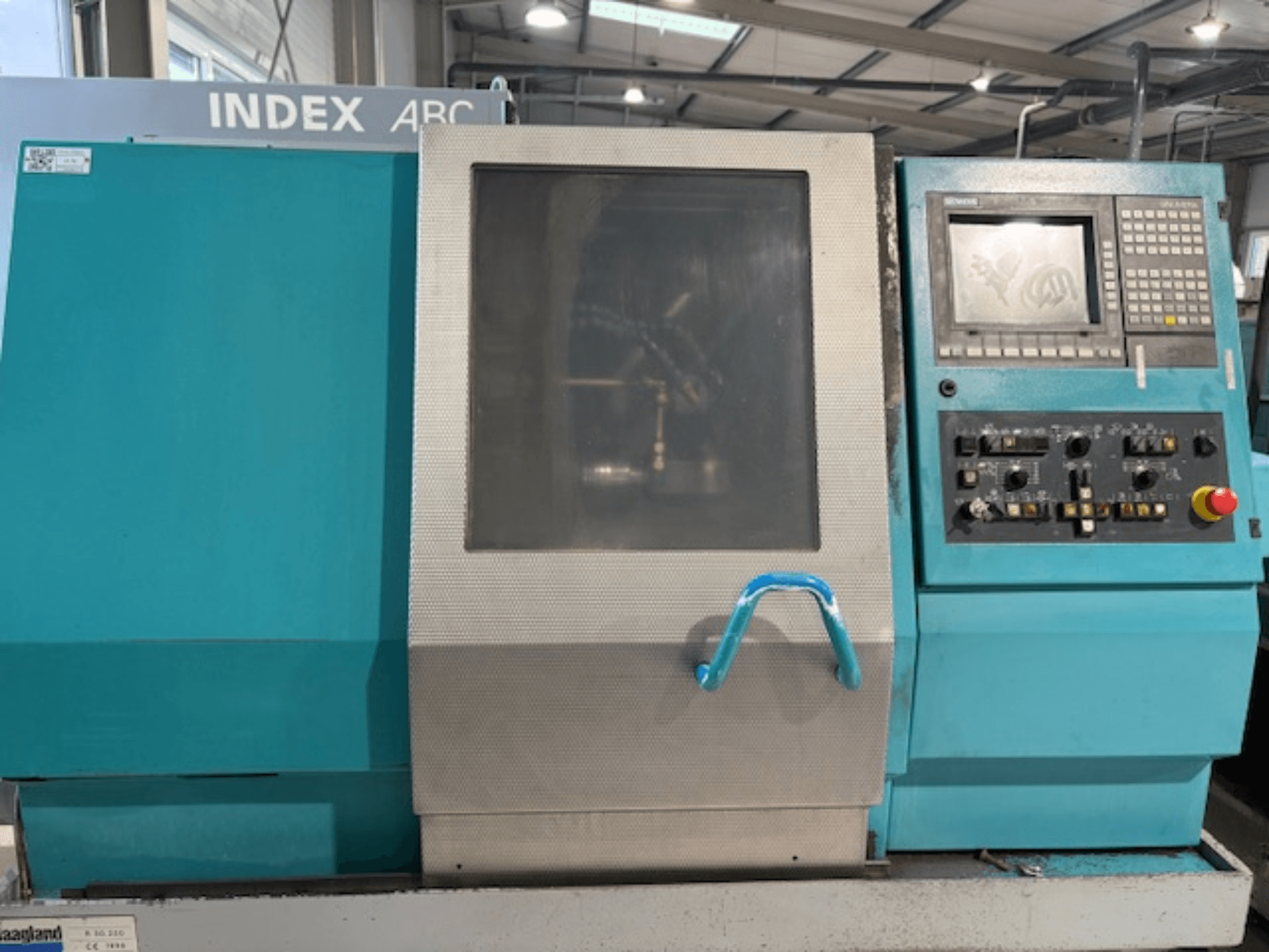 Index ABC 63 Horizontal Turning Machine, front view showing control panel, blue body, and transparent window.