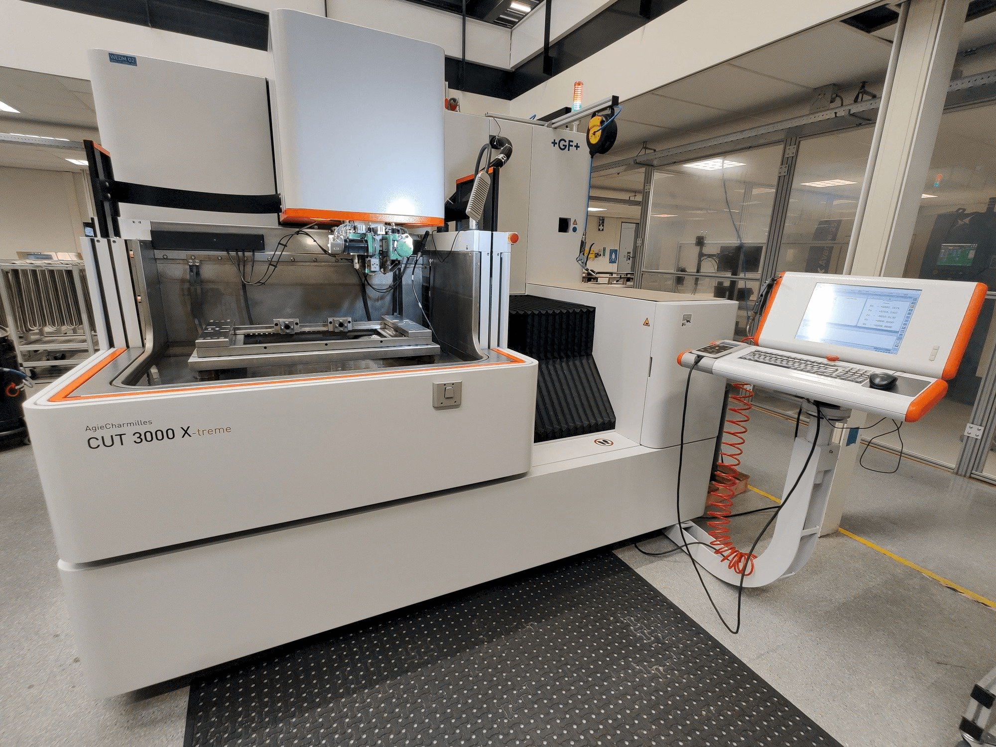 Front view of GF AgieCharmilles CUT 3000 X machine