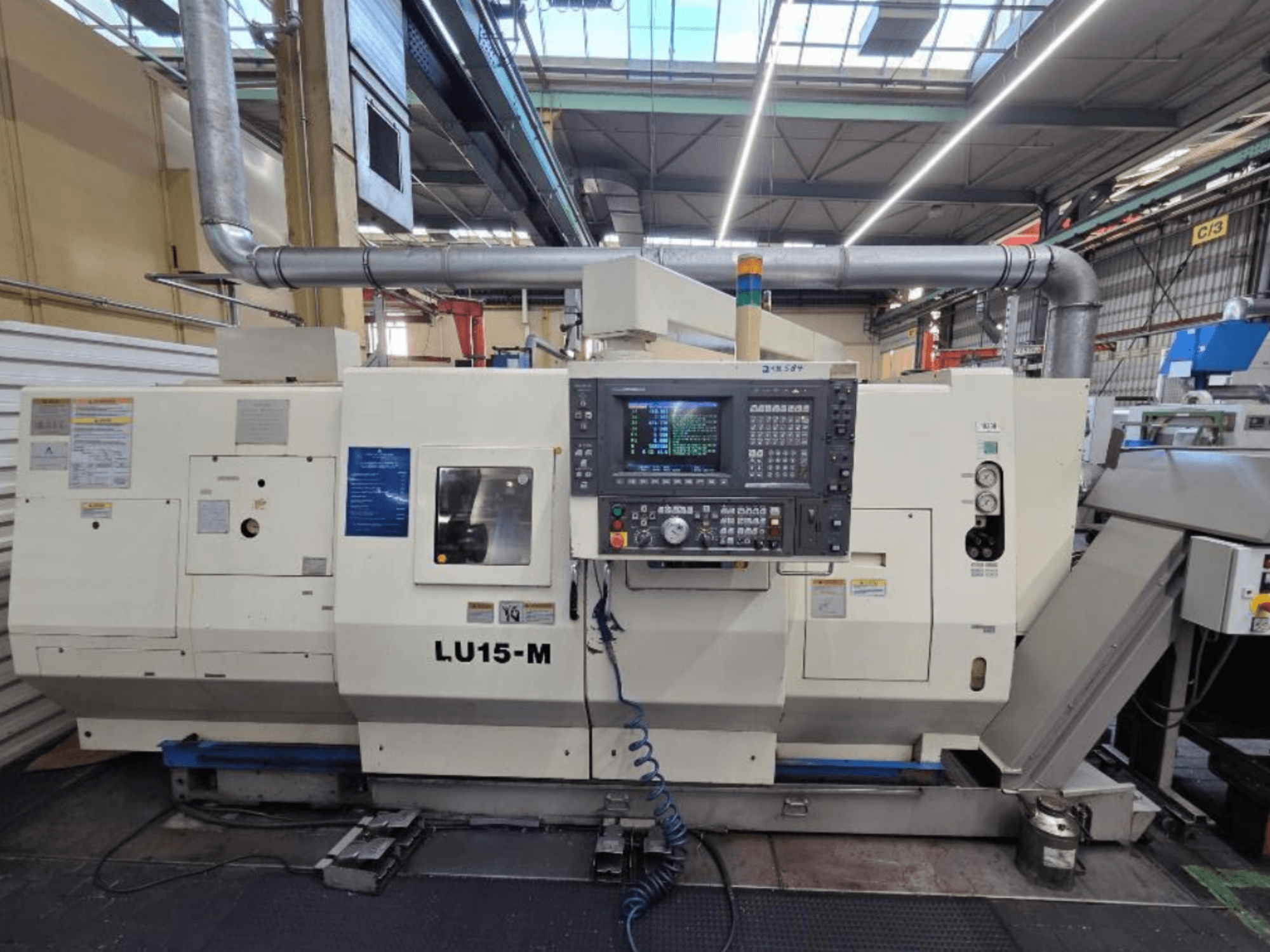 Okuma LU15 M-2SC 1000 horizontal turning machine, front view showing control panel and machine features in a workshop setting.