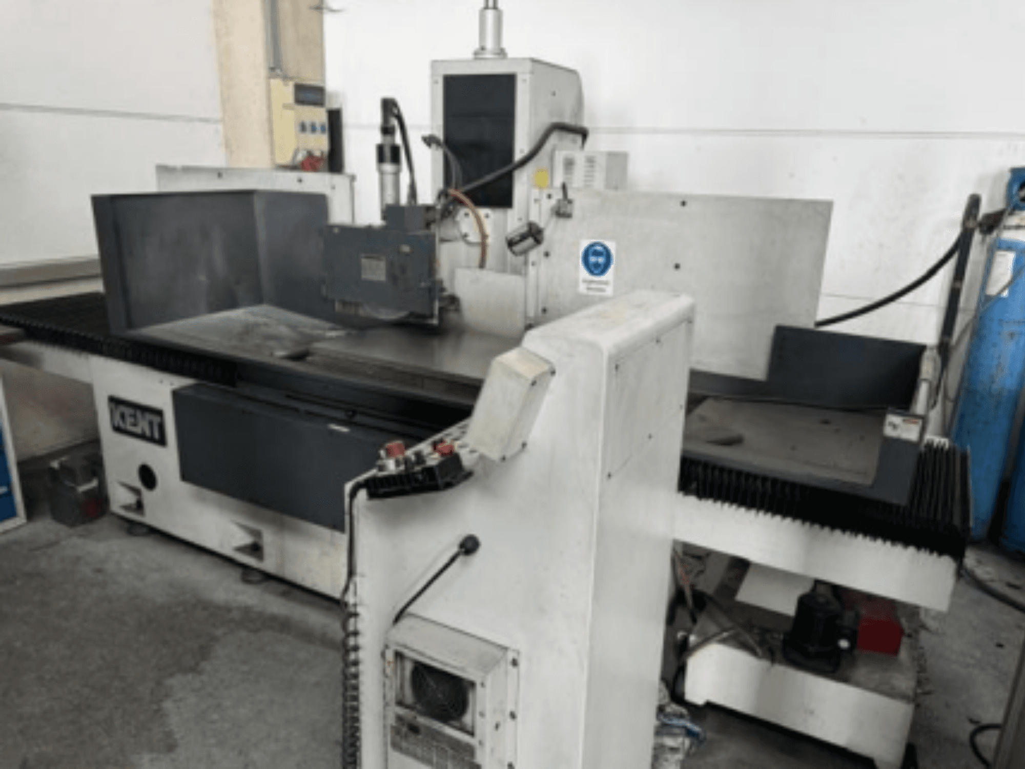 Kent KOS-510V.MA2 surface grinding machine in a front view, showcasing the control panel and grinding area.