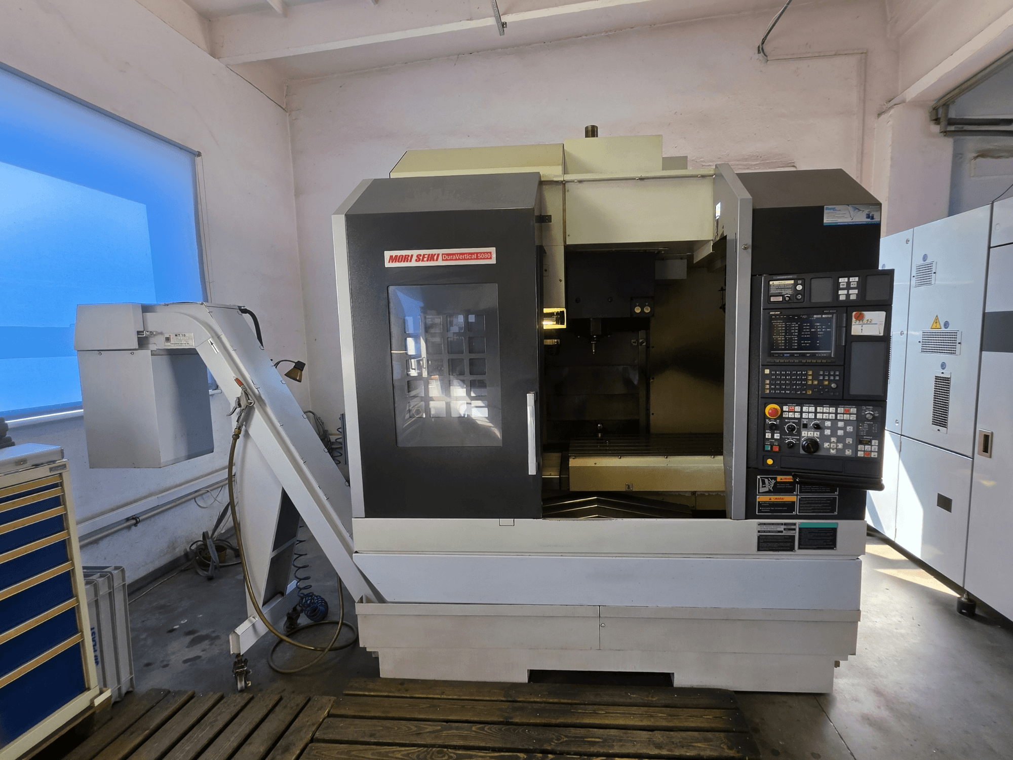 MORI SEIKI DuraVertical 5080 vertical machining centre, front view displaying control panel, spindle, and tool holder.