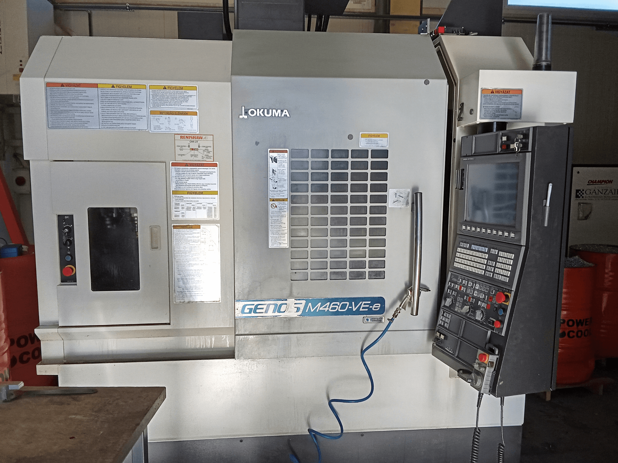 Okuma M460R-VE vertical machining center, front view, showing control panel and operational interface details.