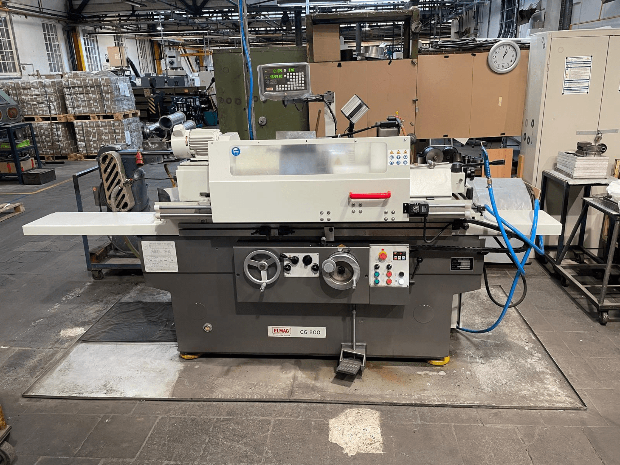 Cylindrical grinding machine ELMAG CG 800, front view, featuring control panel, grinding wheel, and work surface.