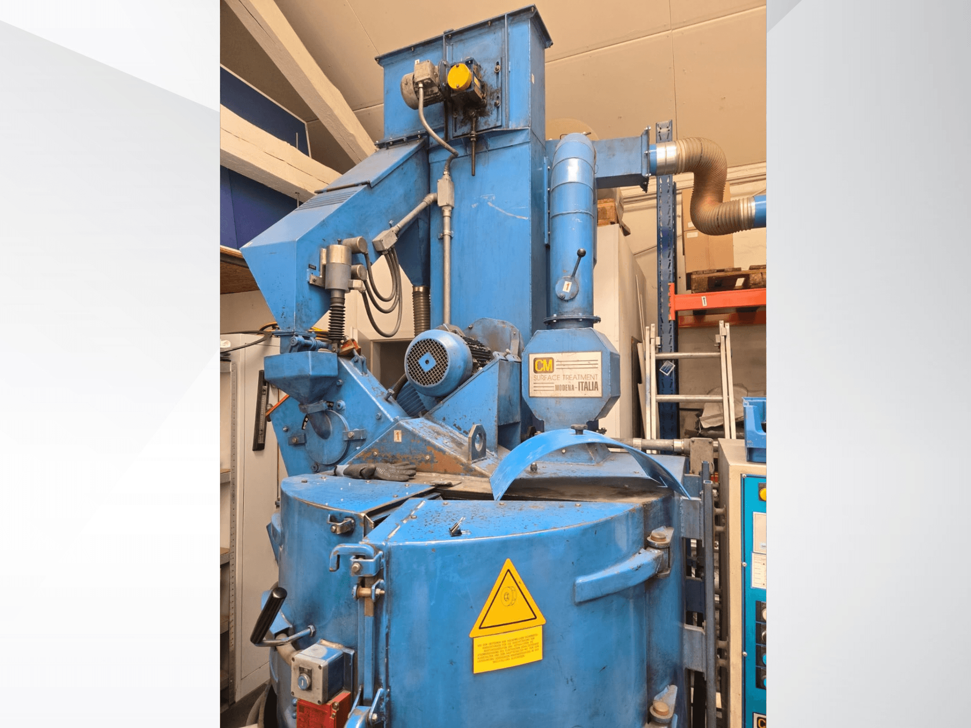 C.M. T-10 machine tool in blue with visible motor, pipes, and control panel; front view highlighting its industrial design.