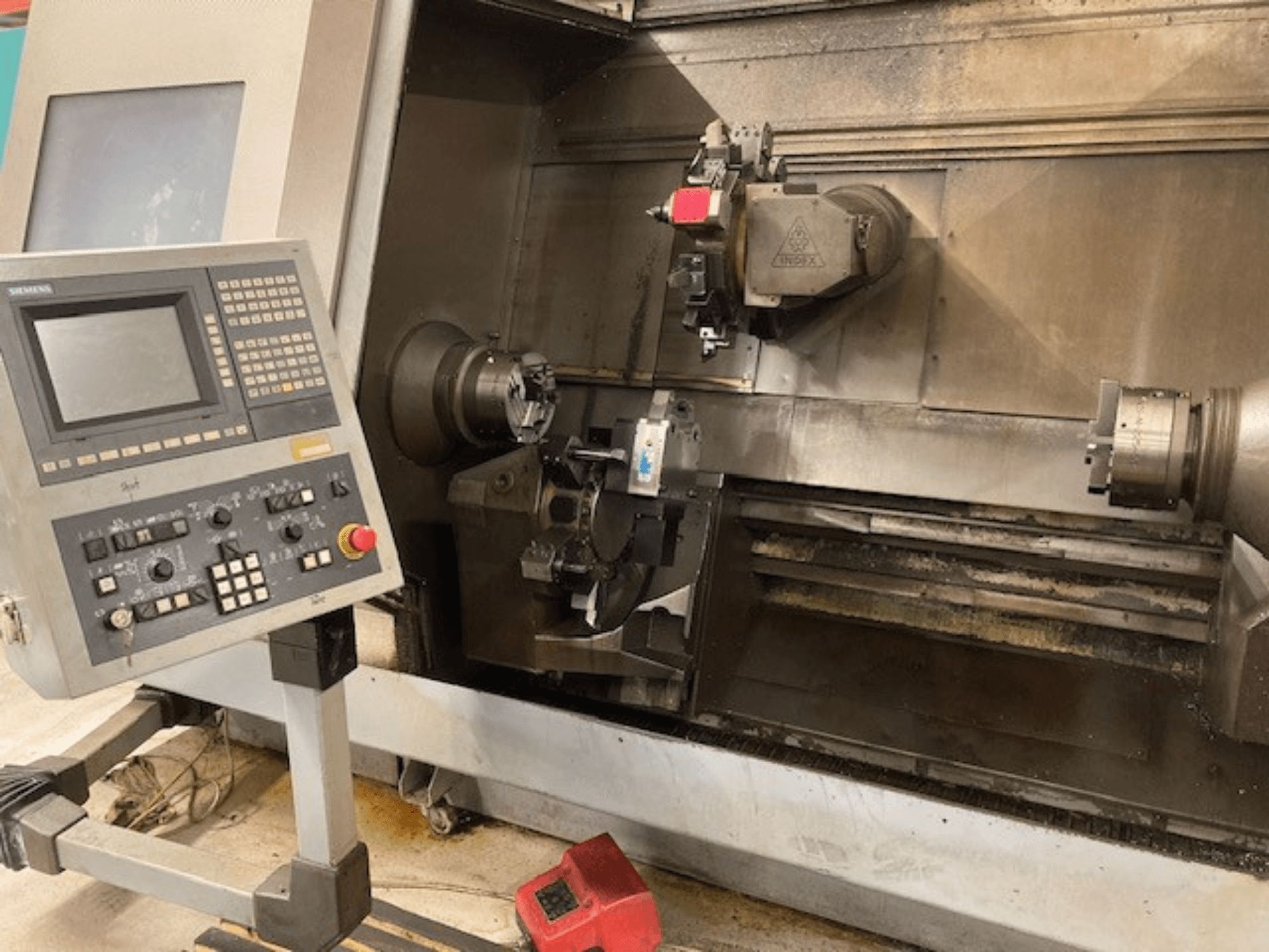 Horizontal turning machine Index G300 L YB with control panel, visible chuck, and work area, front view.