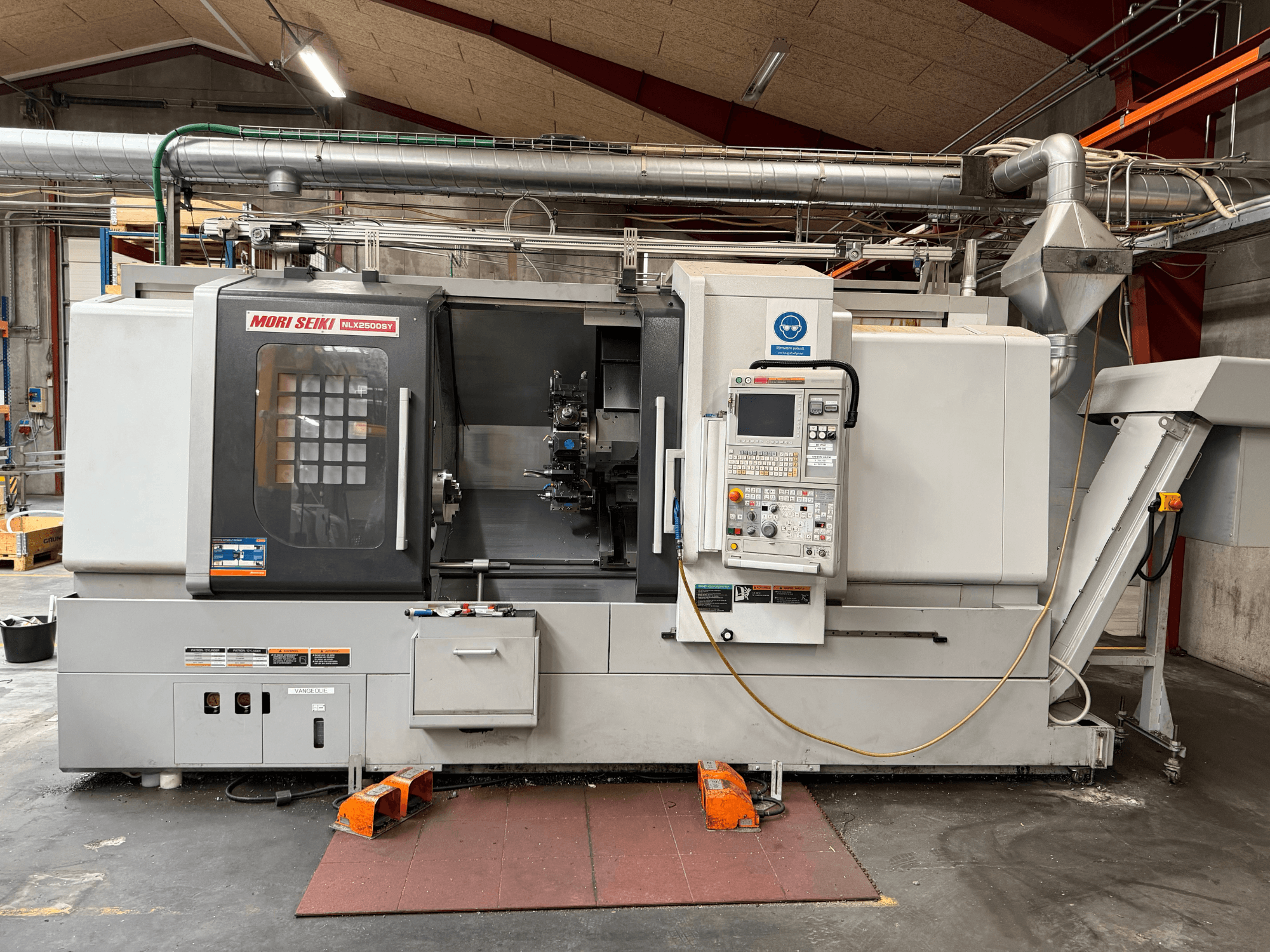 DMG MORI NLX2500SY/1250 horizontal turning machine, front view, showing control panel and operational components.