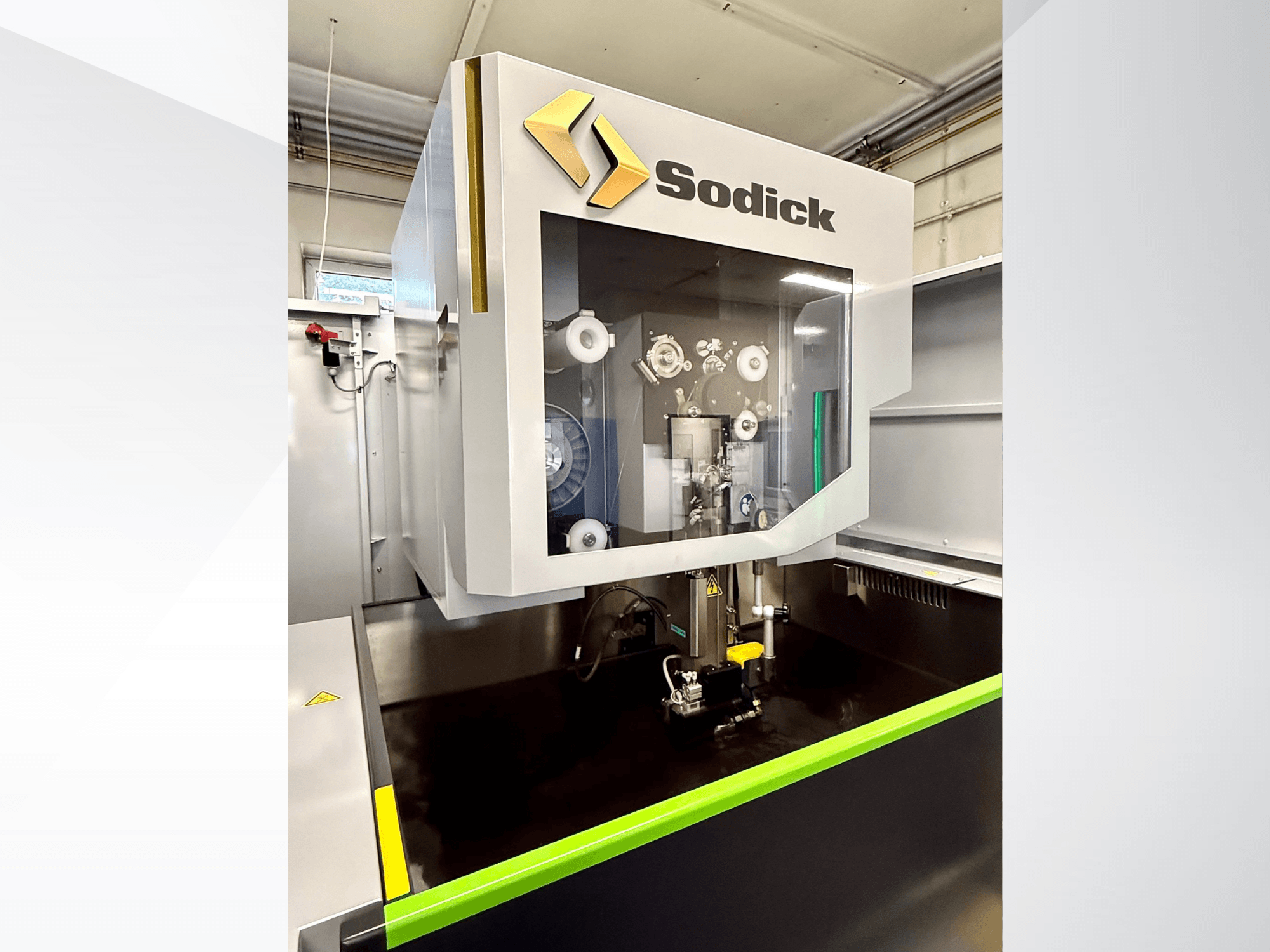 Sodick high-precision machining center front view, featuring a transparent panel showcasing internal components and controls.