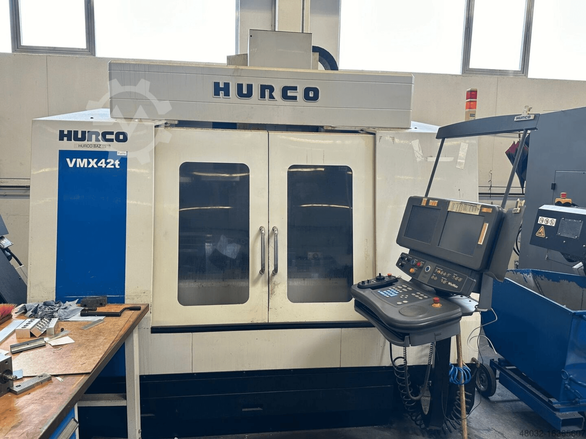 Hurco VMX42t Vertical Machining Centre, front view, displaying control panel and visible interior with tool workpieces.