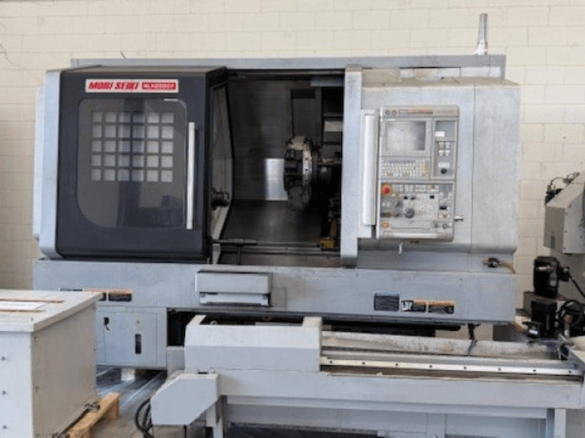 MORI SEIKI NLX 2500Y horizontal turning machine, front view, showcasing control panel and work area.