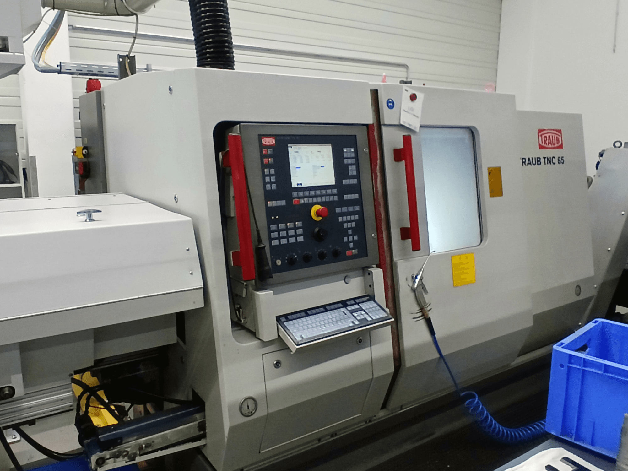RAUB TNC 65 DG horizontal turning machine, front view, featuring control panel and tool interface.
