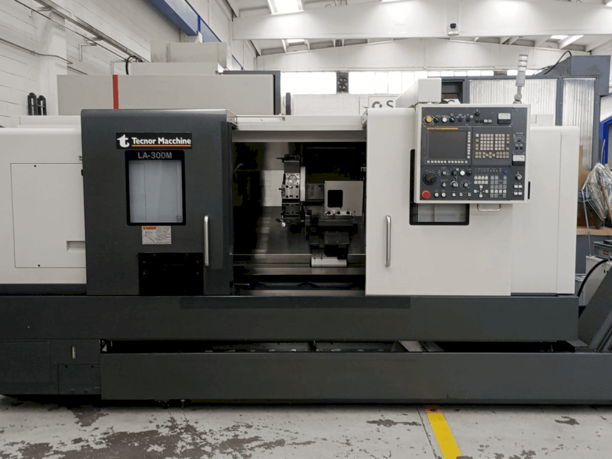 Front view of Takisawa LA-300 CNC machine