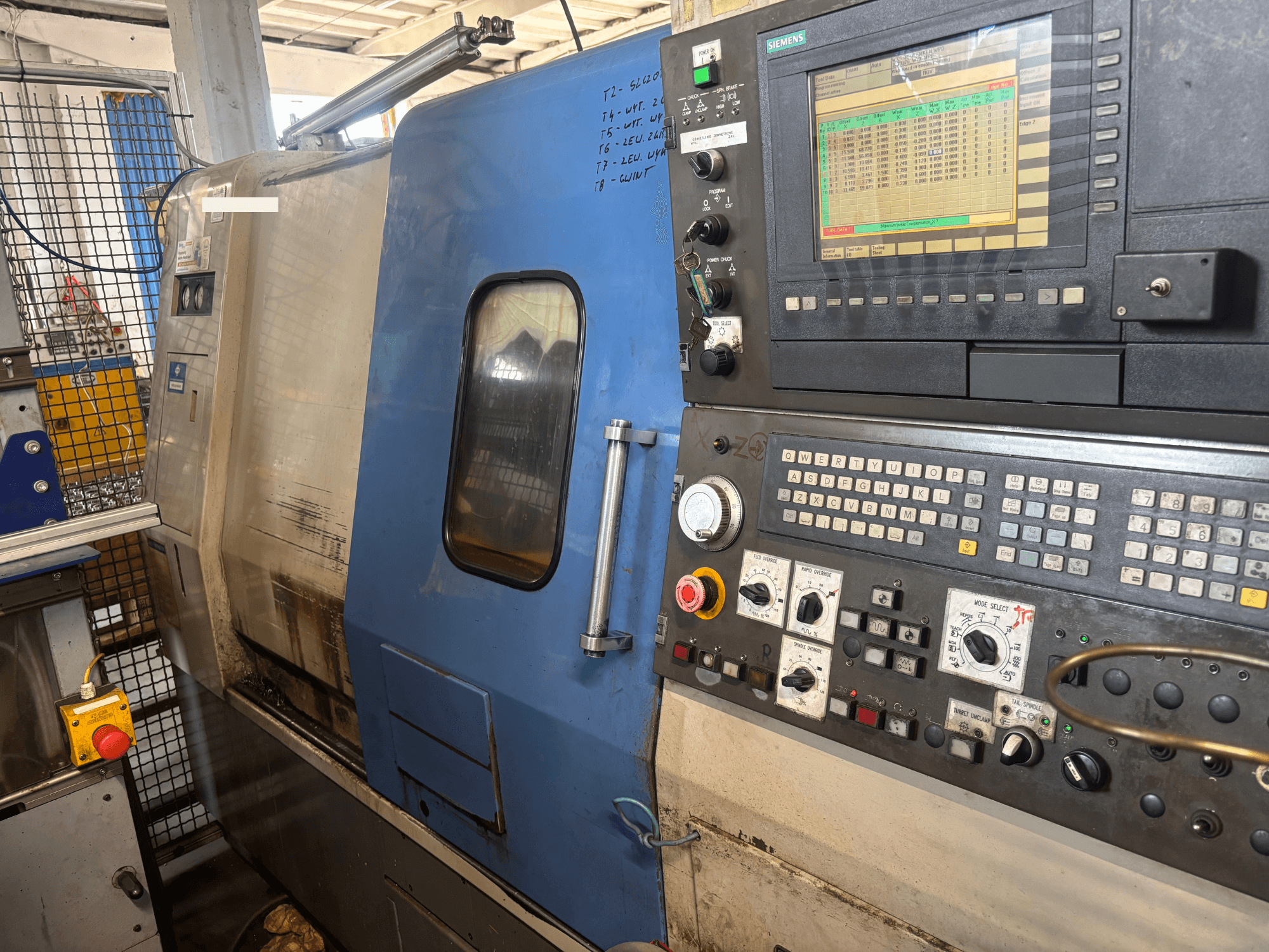 Hyundai HIT-200C horizontal turning machine, front view, featuring a Siemens control panel and operational buttons.