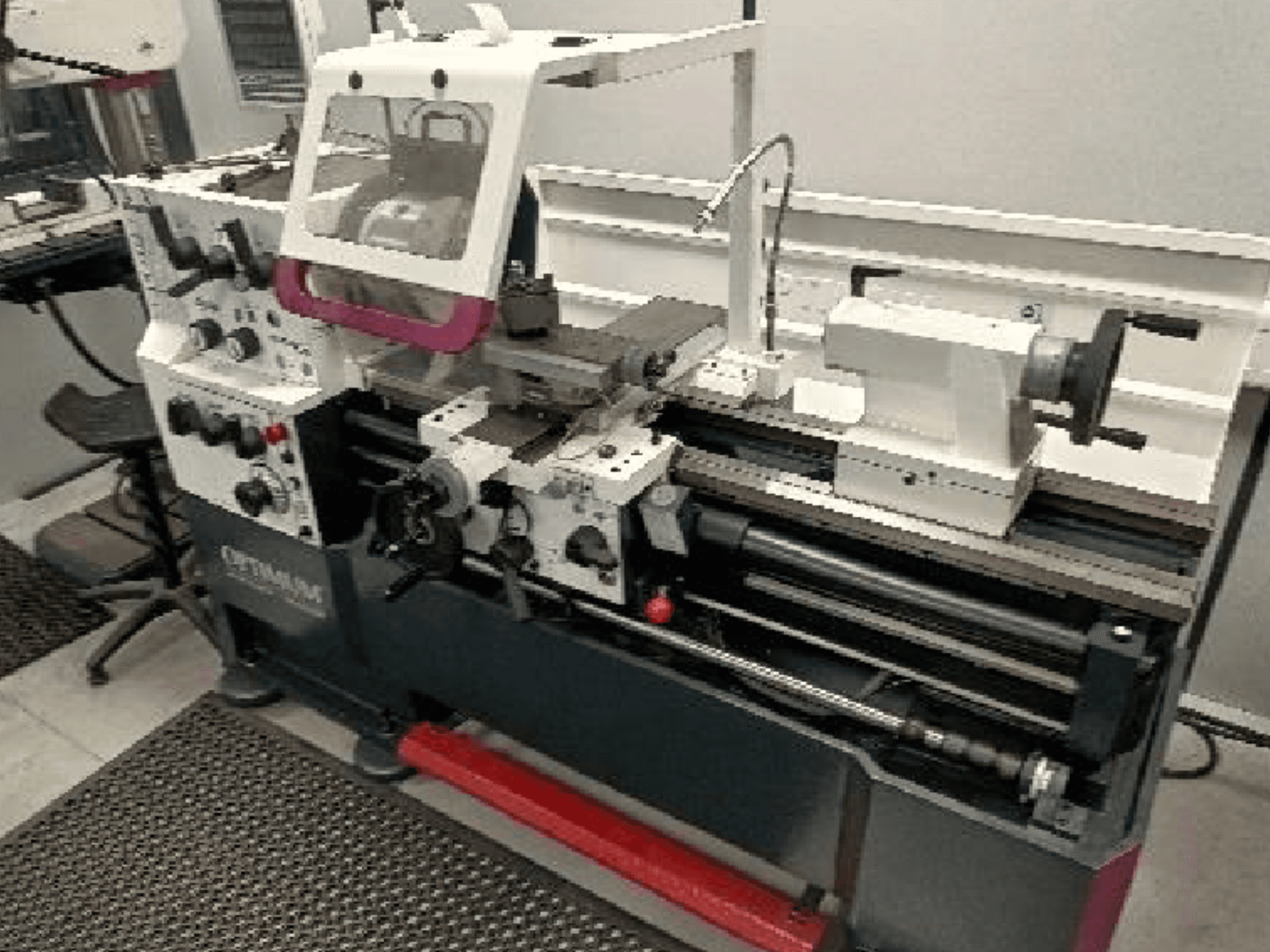 Optimum TH 4610 machine tool in front view, showcasing controls, spindle, and workspace area with visible detail.