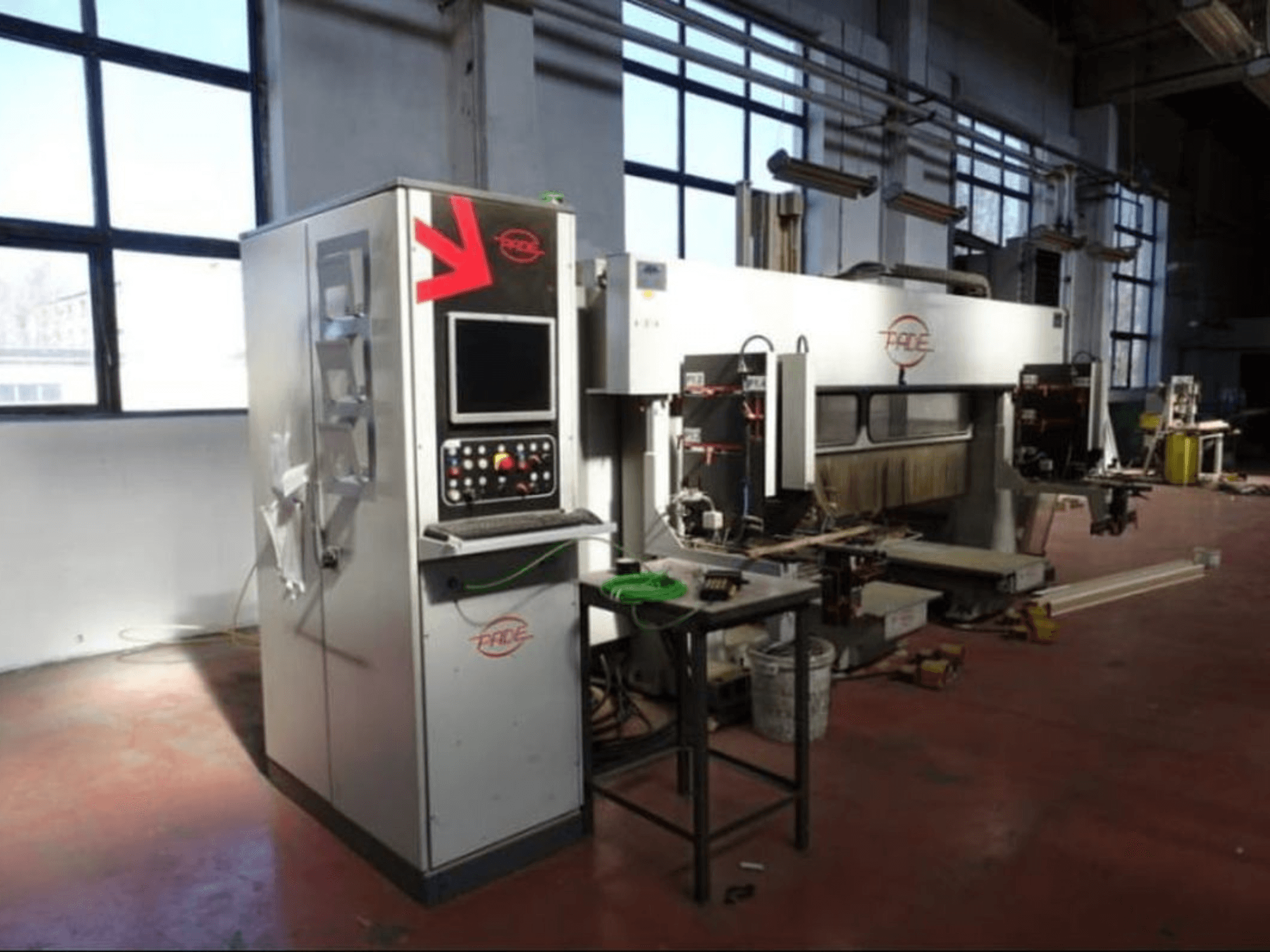 CNC Wood Machining Centre PADE VELUX, front view with control panel, visible tools, and wood pieces in a well-lit workshop.