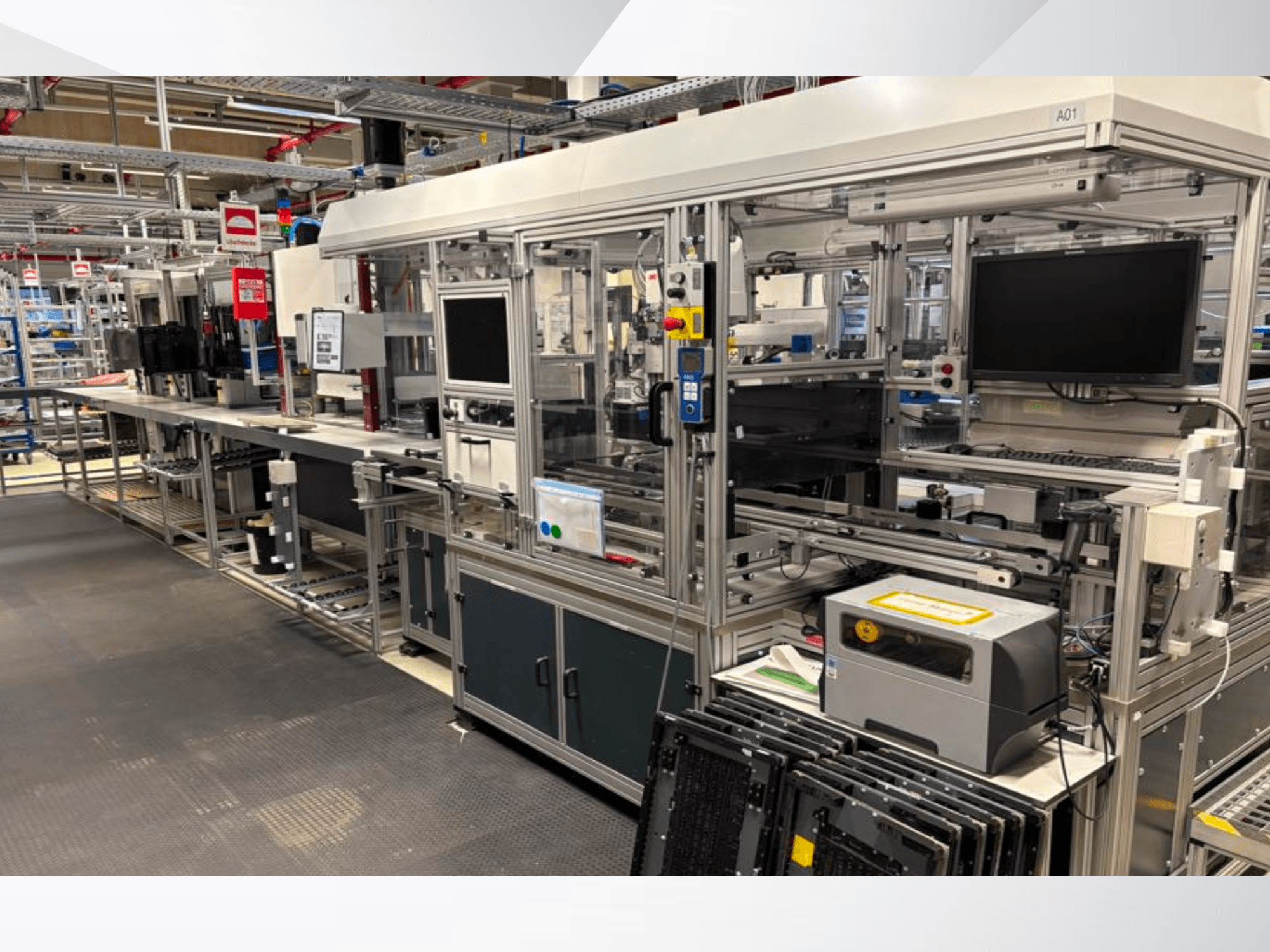 AMADA Jupiter System automation setup in side view, featuring screens, control panels, and machinery components.