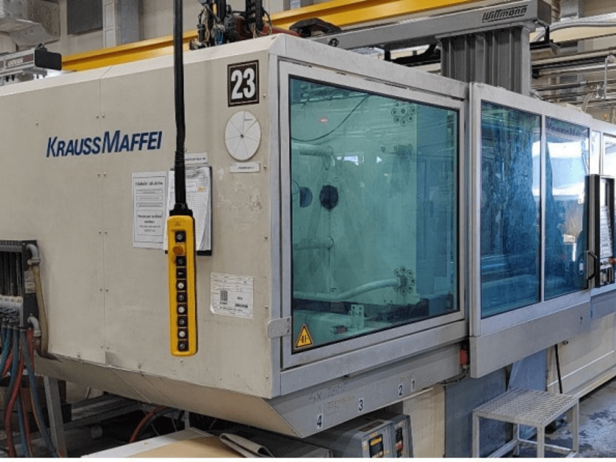 Krauss Maffei KM 350-1900 C2 hydraulic injection moulding machine, front view showing control panel and transparent safety enclosure.