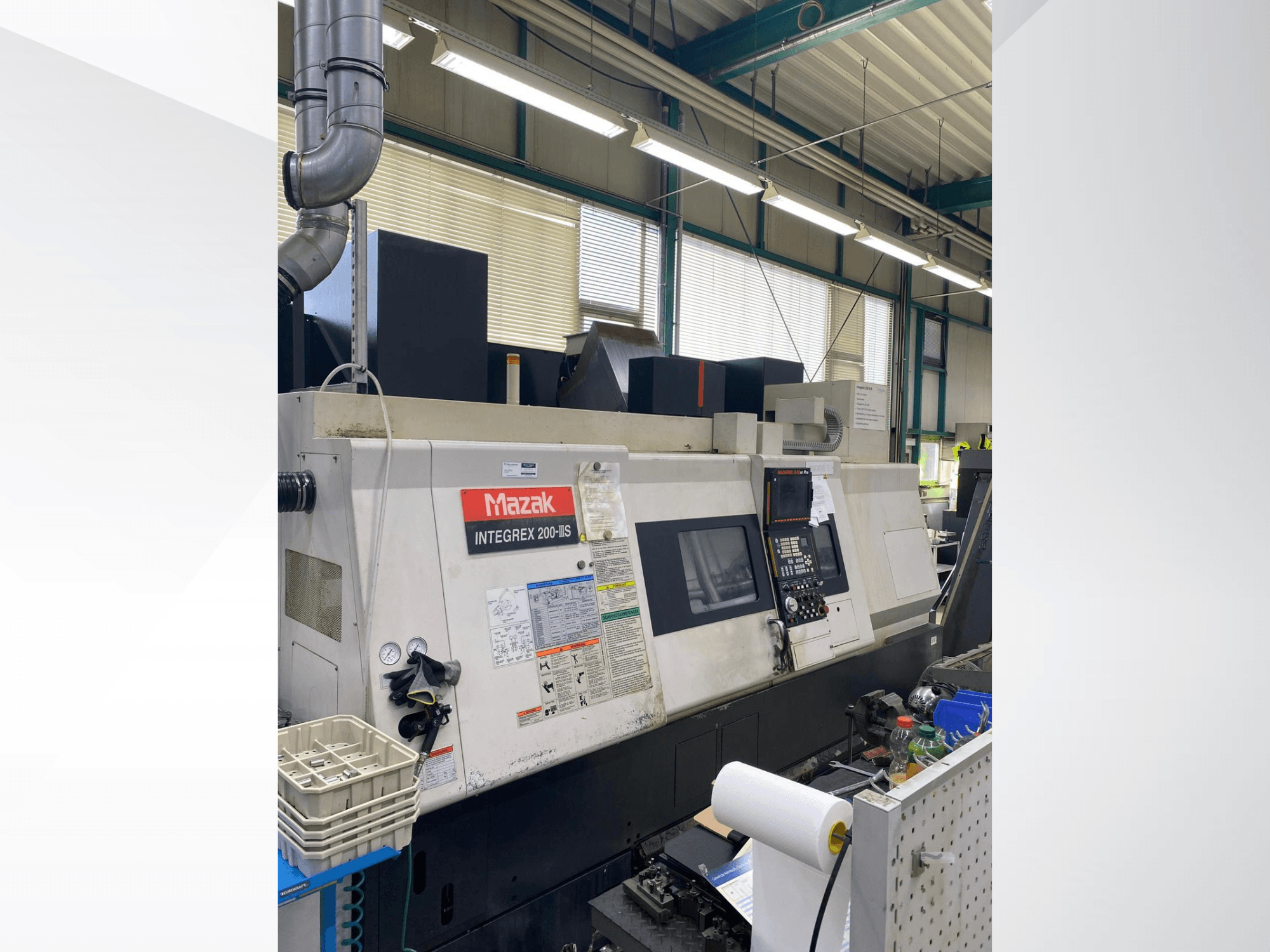 Mazak INTEGREX 200 III S turn-mill centre, side view, showing the control panel, gauges, and workspace tools.