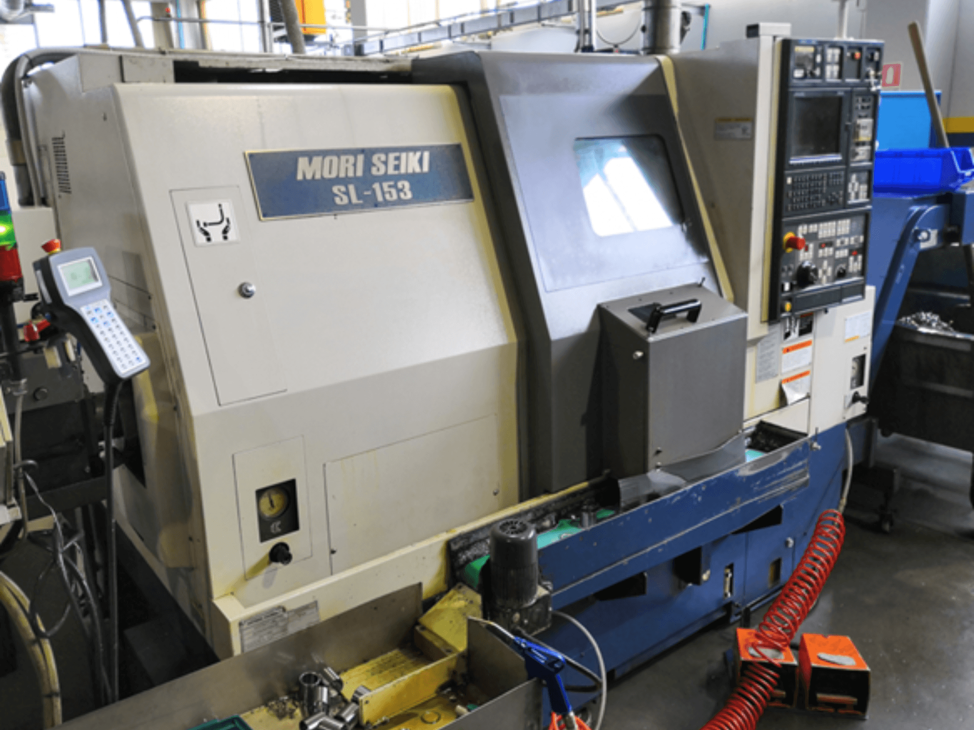 MORI SEIKI SL-153 SMC horizontal turning machine, front view, showcasing control panel and operating features.