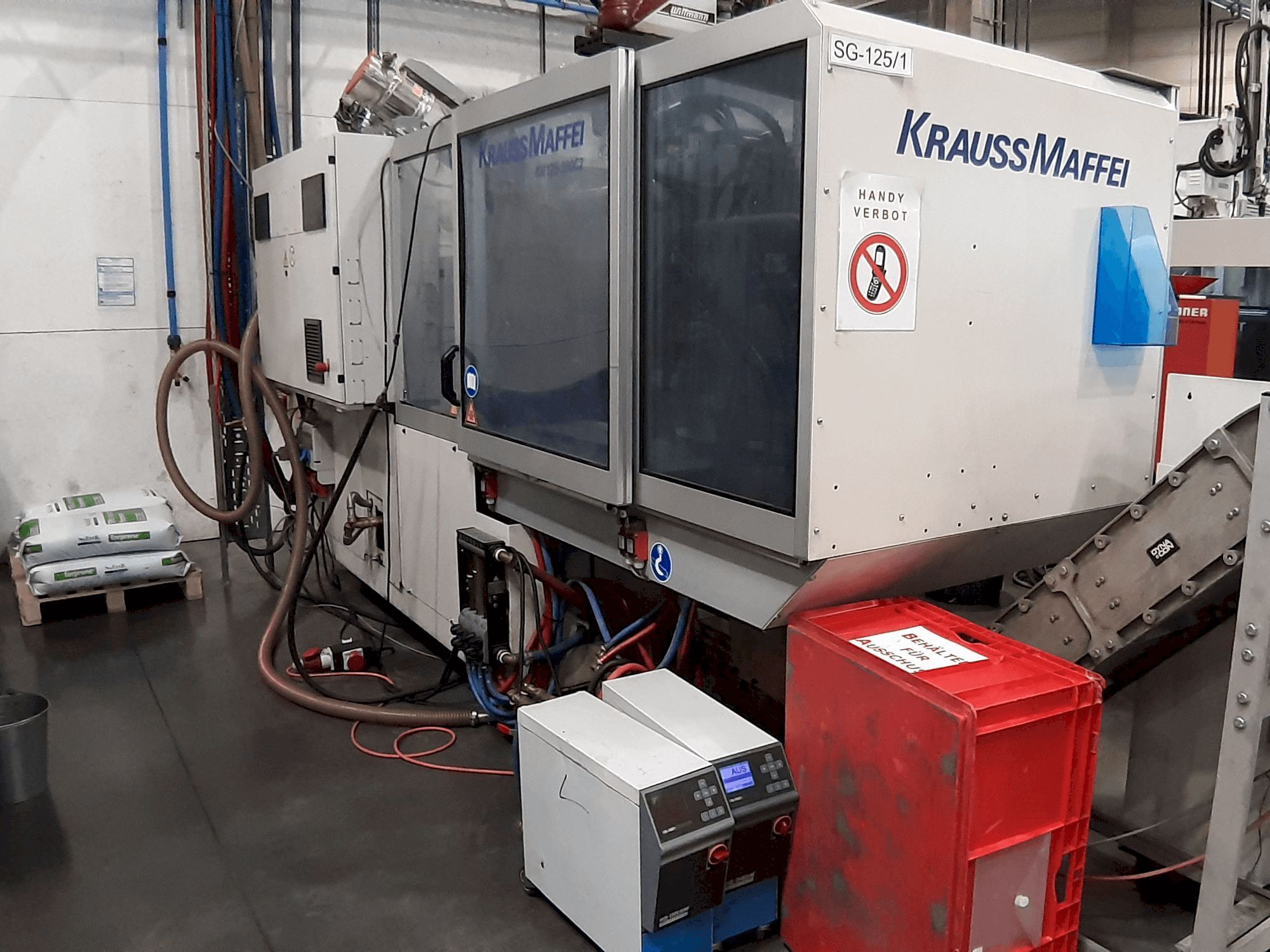 Front view of Krauss Maffei 125 - 390 CX machine