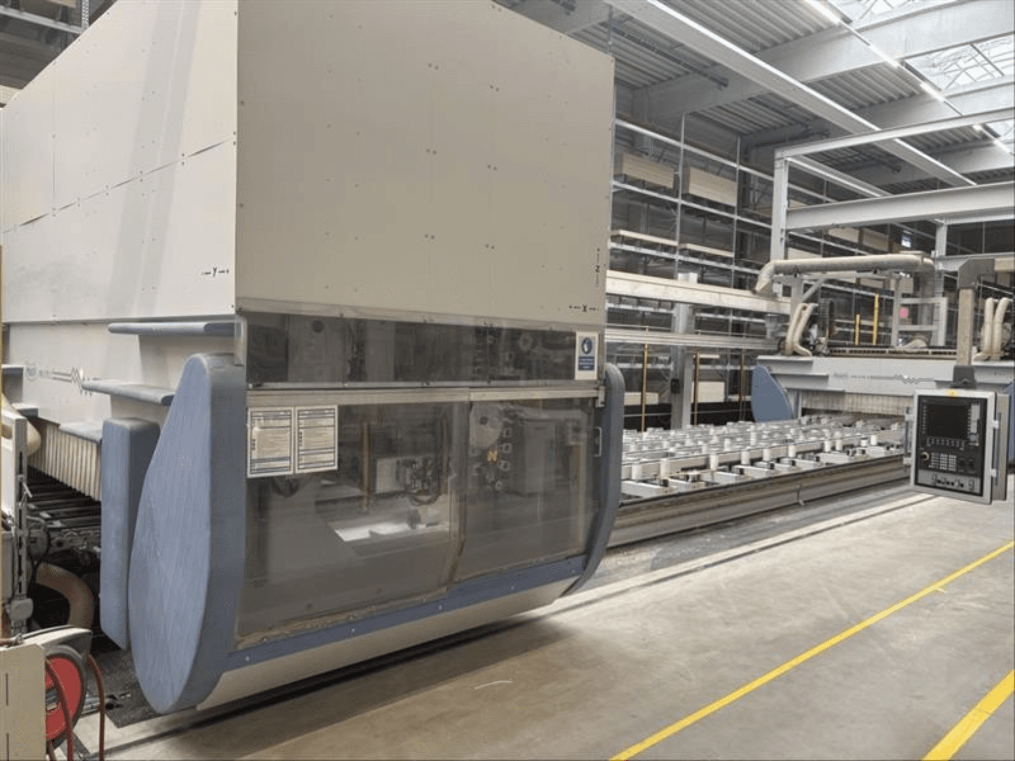 CNC Processing Center MAKA PM 270 X, front view showing control panel and machinery details in a factory setting.