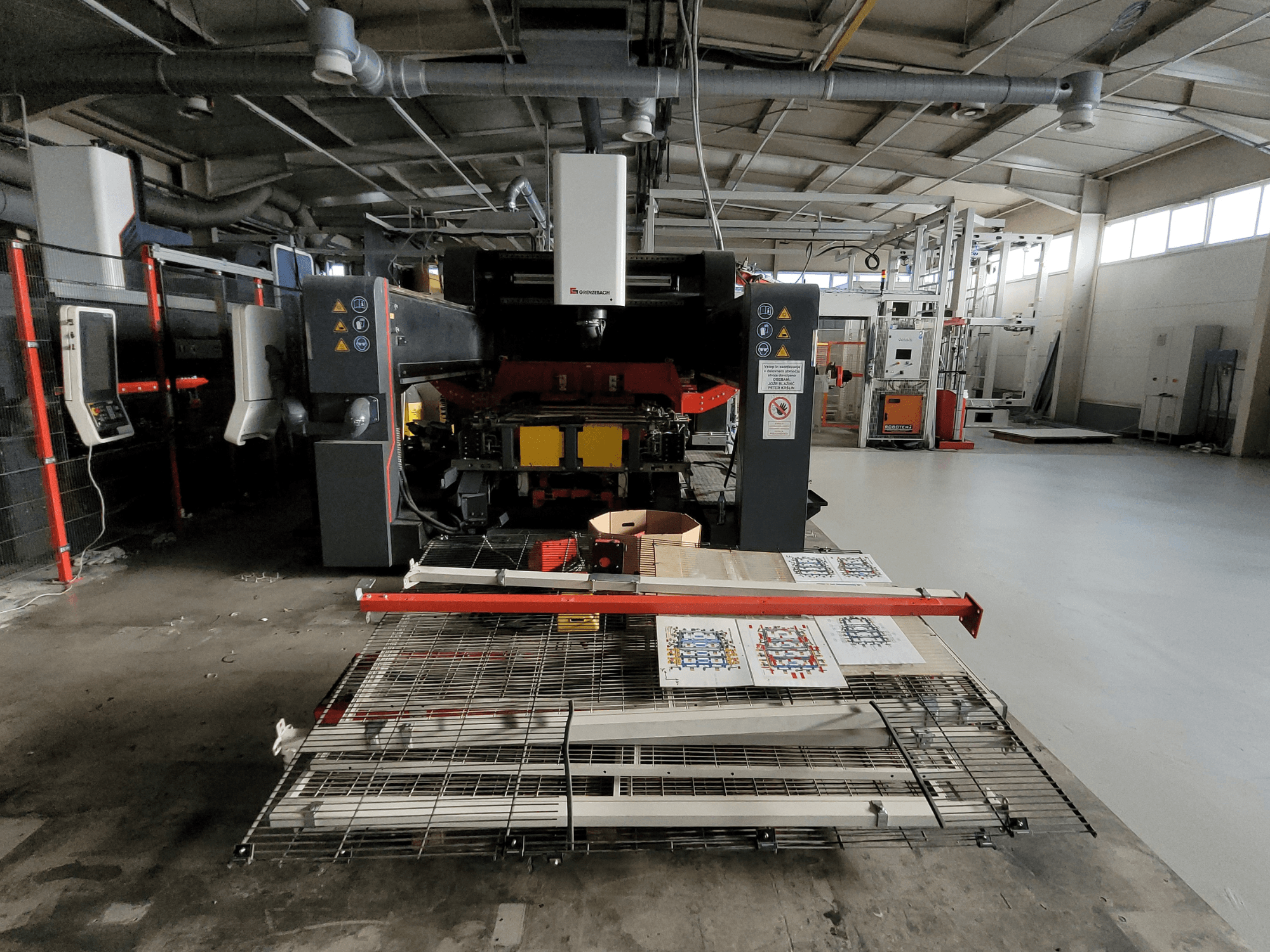 GRENZEBACH FSW Machine DSM 2400, front view in factory setting, showcases machining setup with printed materials and equipment.