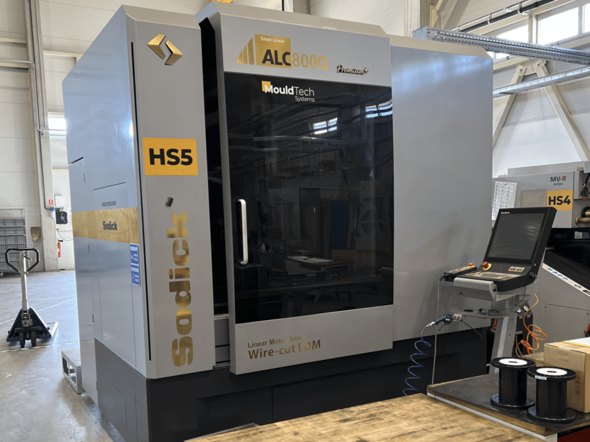 Sodick ALC800G Premium Wire EDM Machine, front view, showcasing control panel and intricate design details.