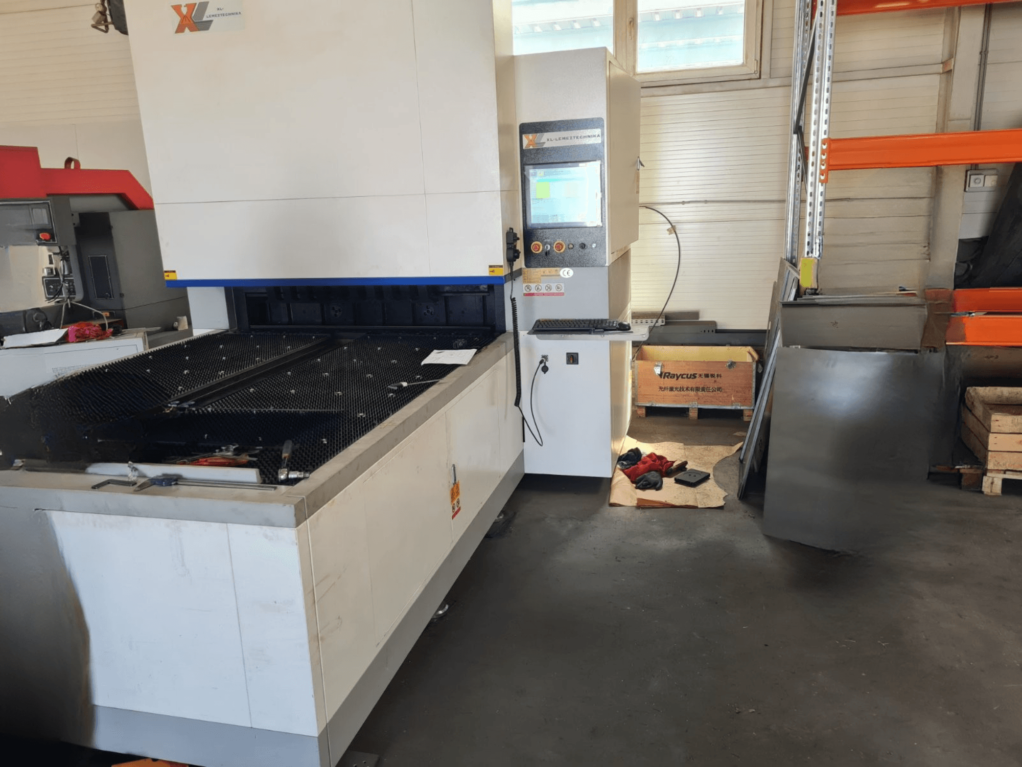 GWEIKE GKS-BC0315 press brake in a workshop, front view showing control panel and work surface with tools nearby.