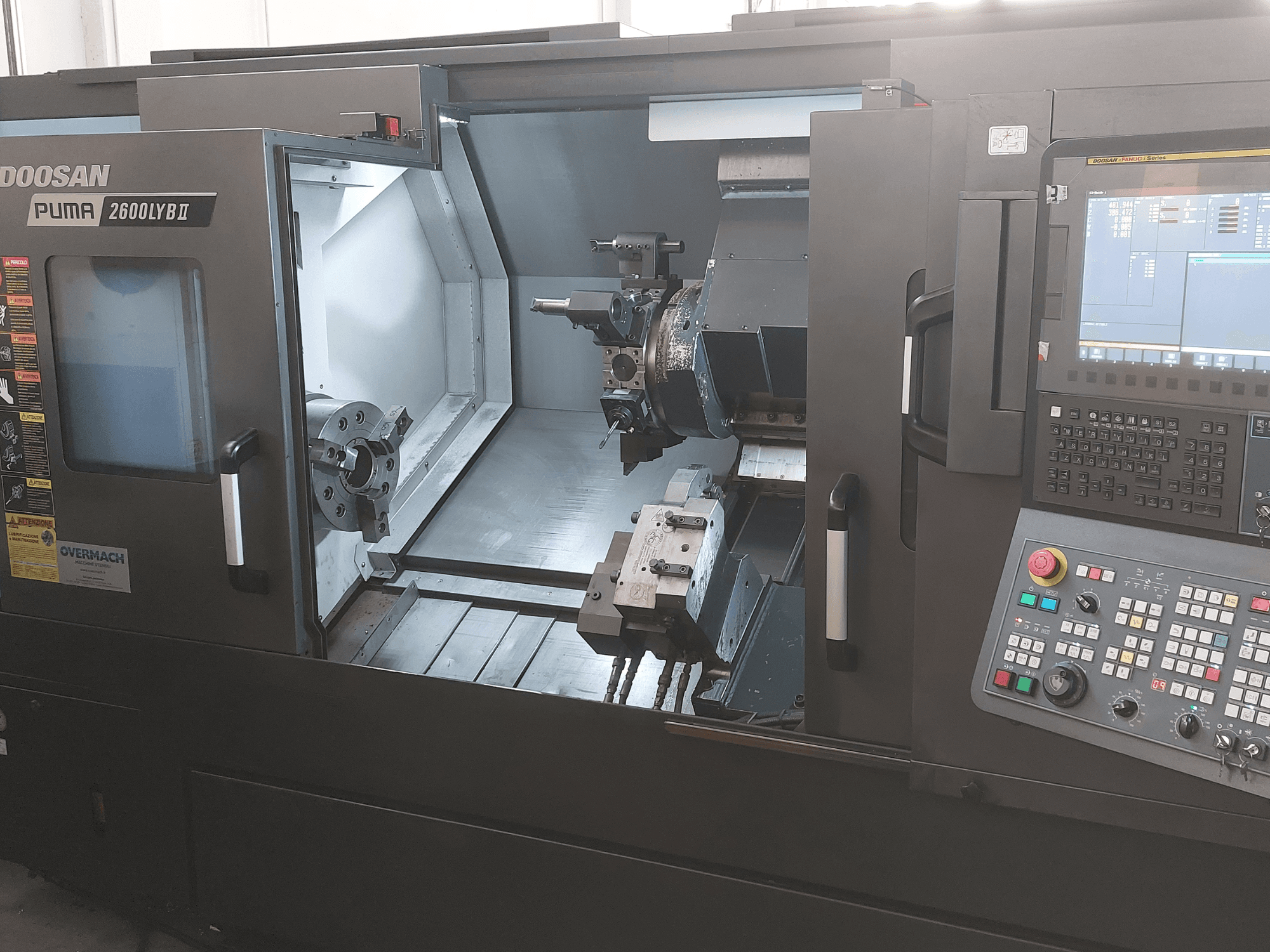 DOOSAN Puma 2600 LYB II Horizontal Turning Machine in front view, showcasing interior with chuck, tool holder, and control panel.
