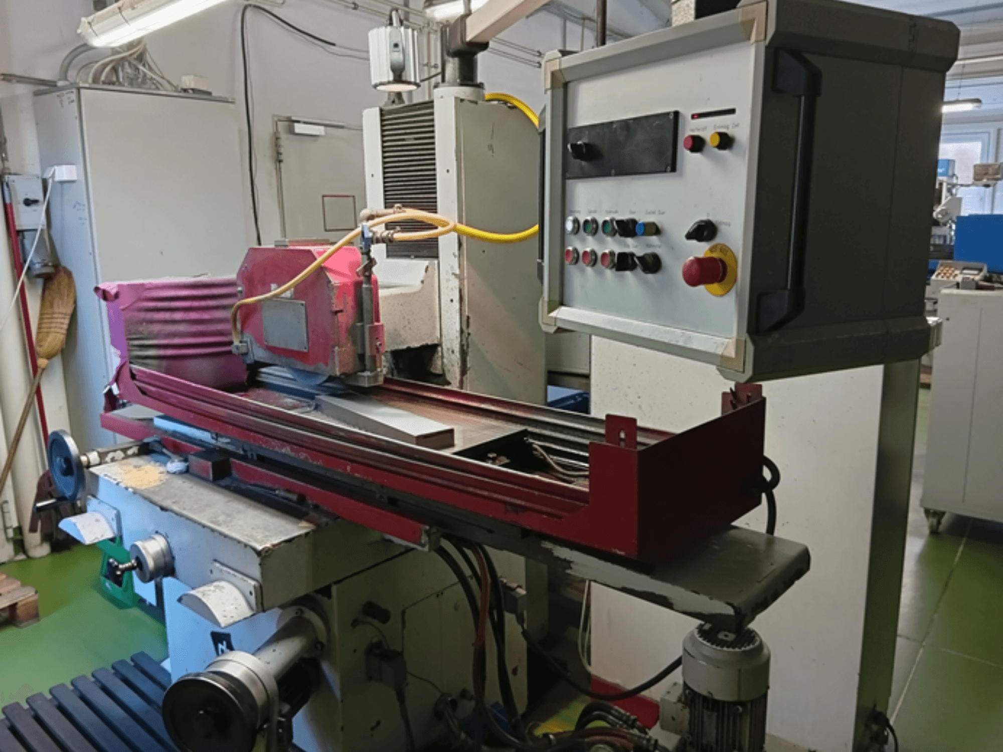 DEGEN FS-S3060 surface grinding machine, front view showing grinding wheel, control panel, and work table setup.