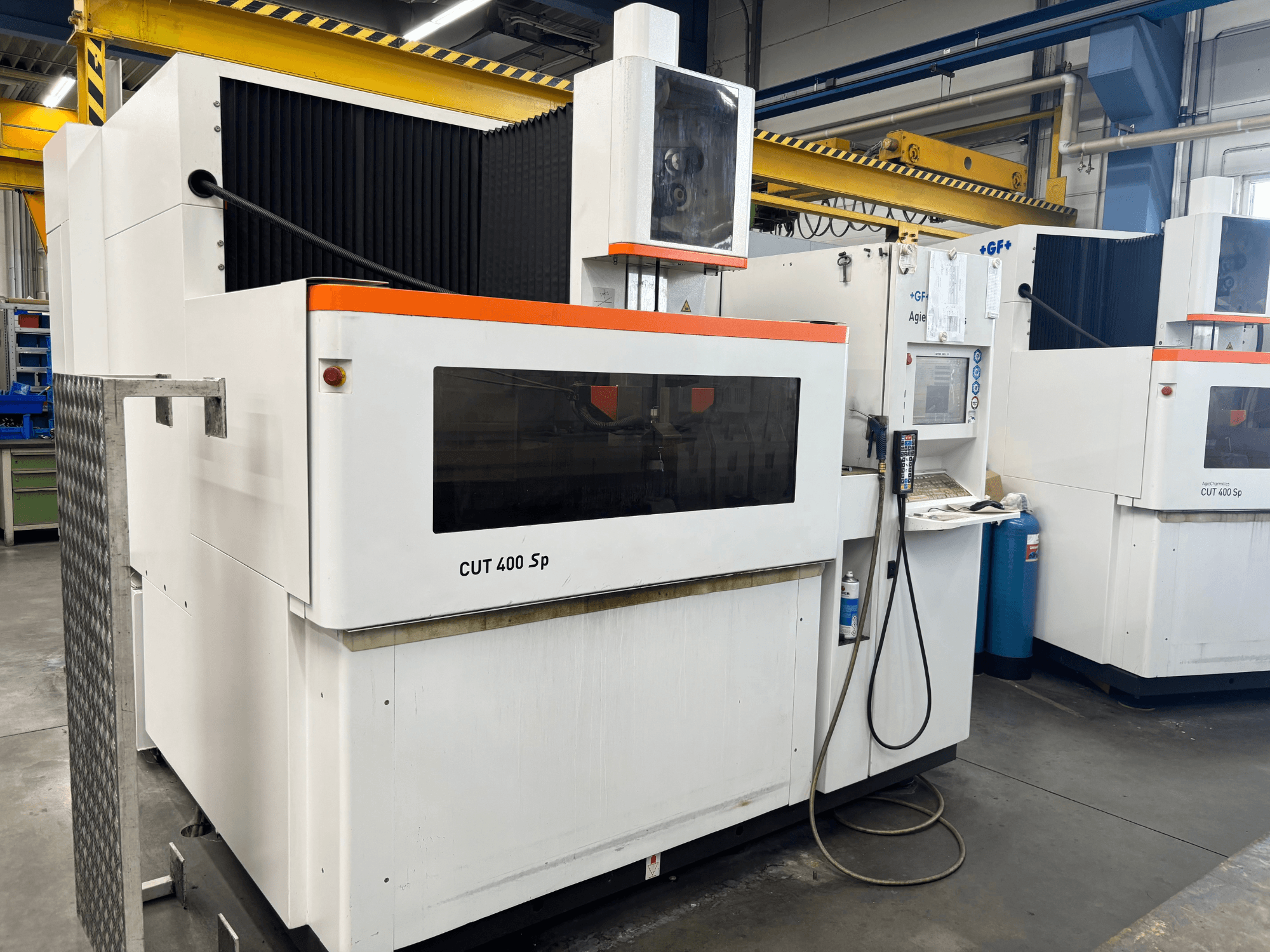Wire EDM machine +GF+ AGIECHARMILLES CUT 400 Sp, front view, featuring control panel and attached cooling system.