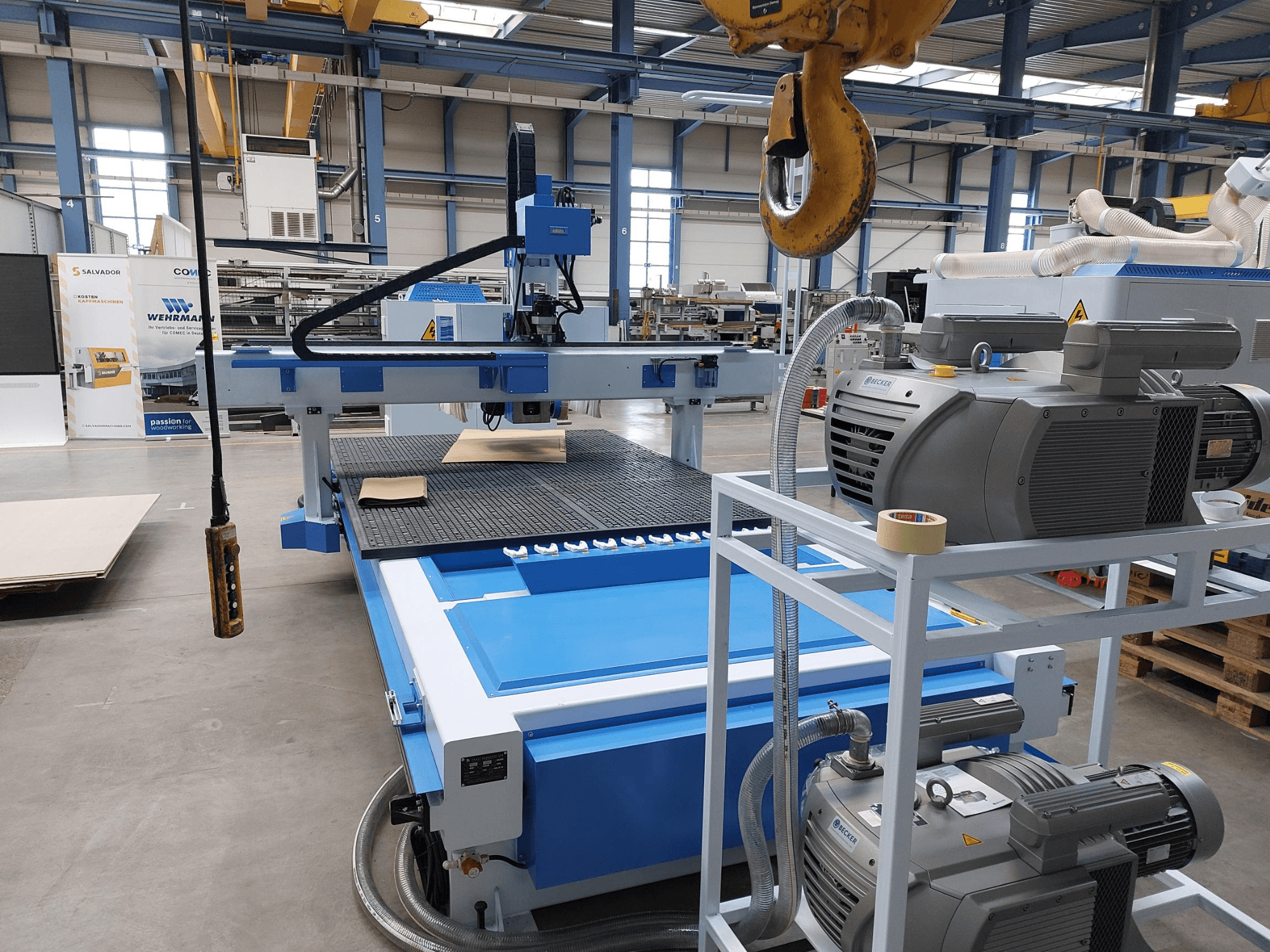 CNC Wood Machining Centre QUICK CNC UA 481, front view showing control panel, motors, and work surface with wood piece.