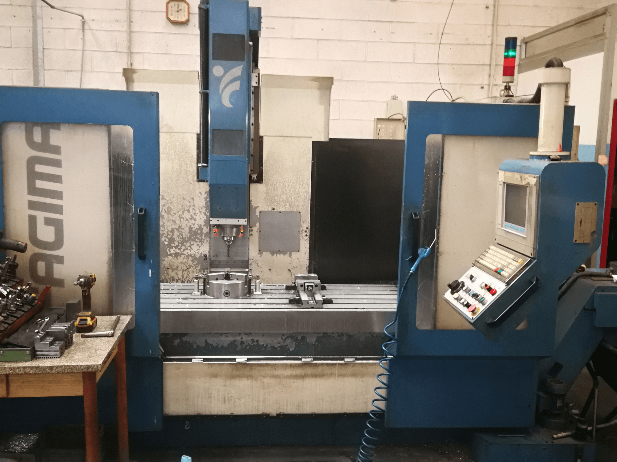 Fagima FAST 160 vertical machining center in a front view, showcasing control panel, worktable, and machine details.
