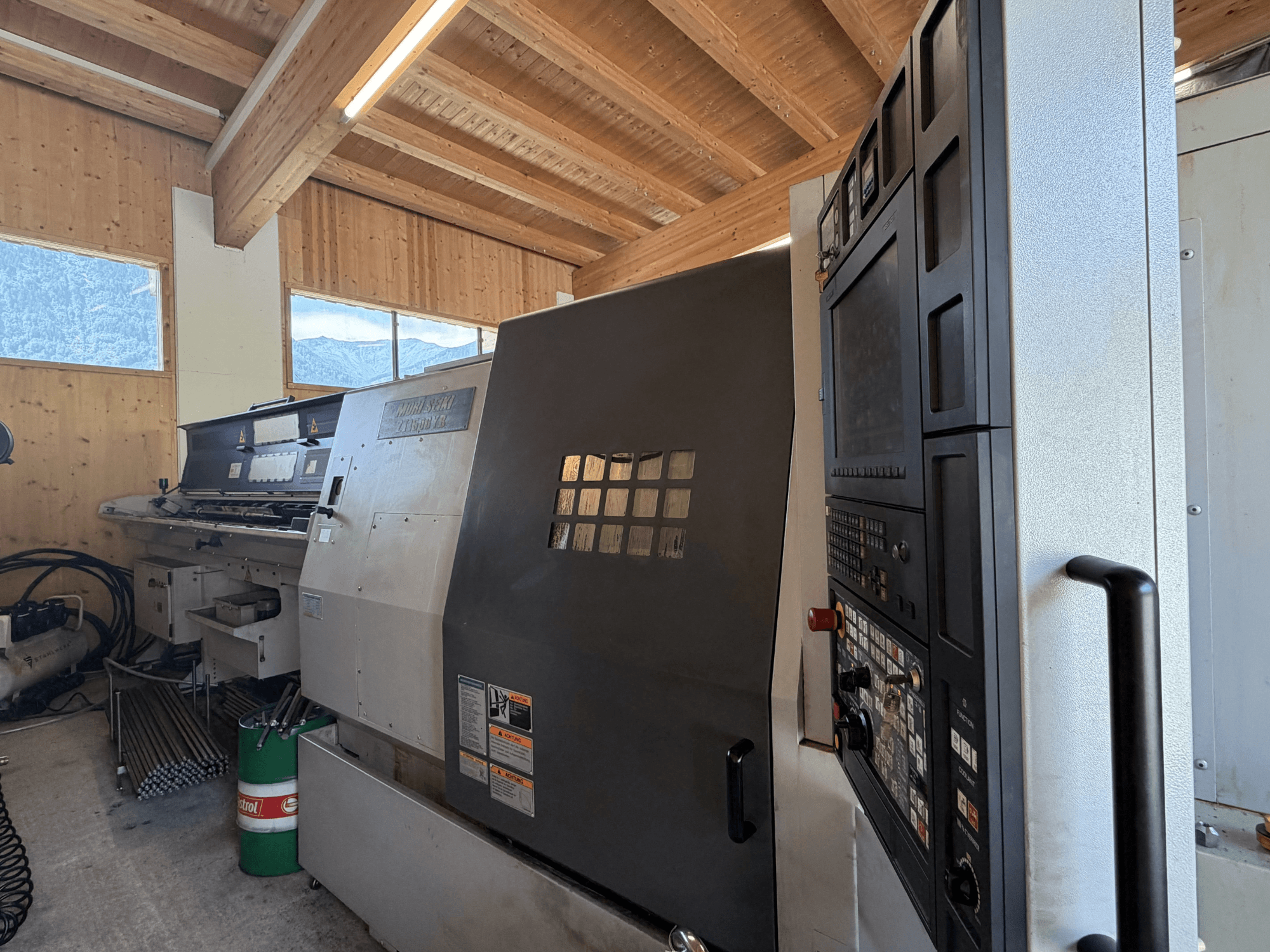 MORI SEIKI ZT1500YB turn-mill centre in a workshop, side view showing control panel and machine features.
