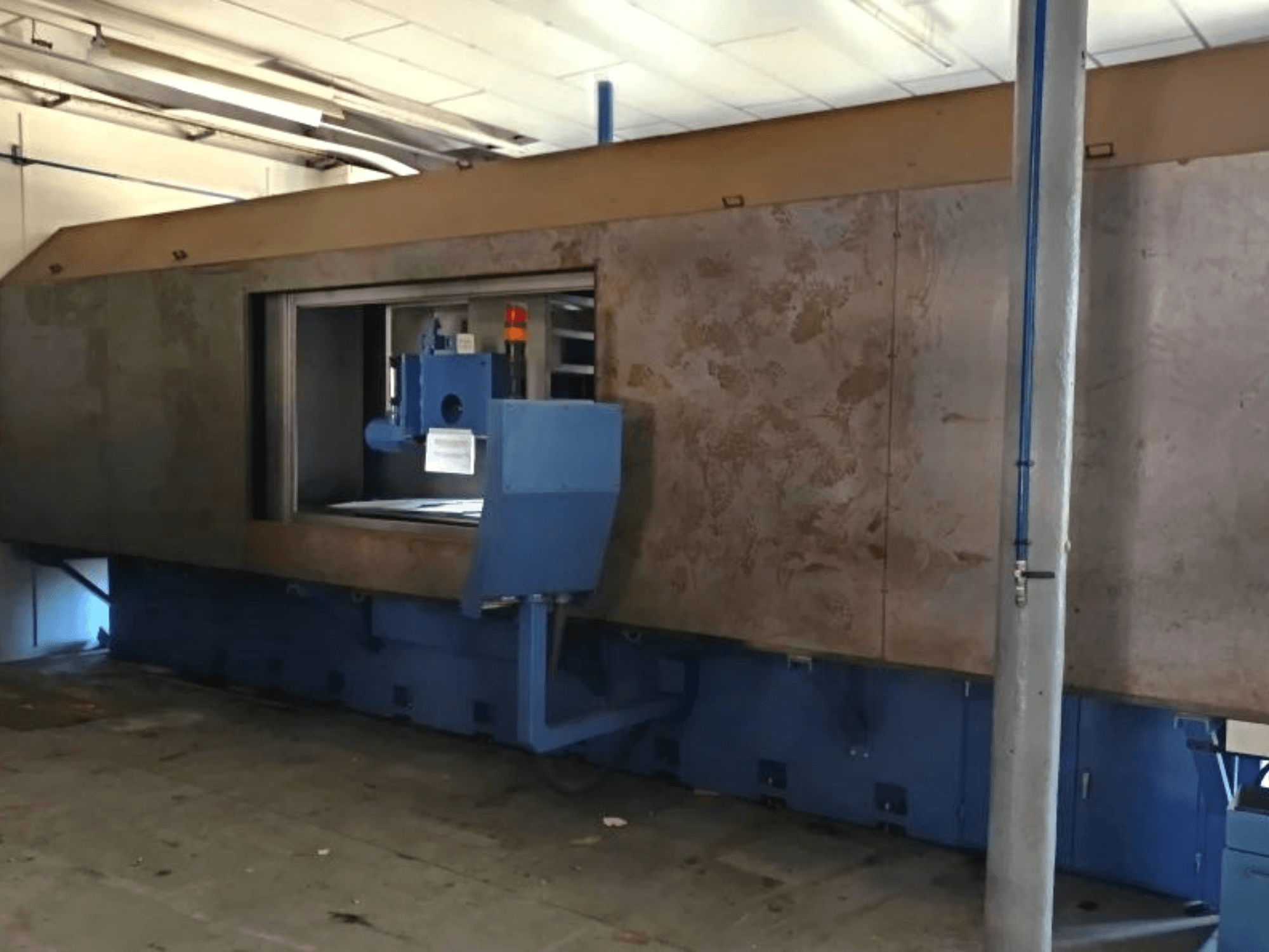 Front view of GER SE 200-75 surface grinding machine with a large steel frame and operator controls on the side.