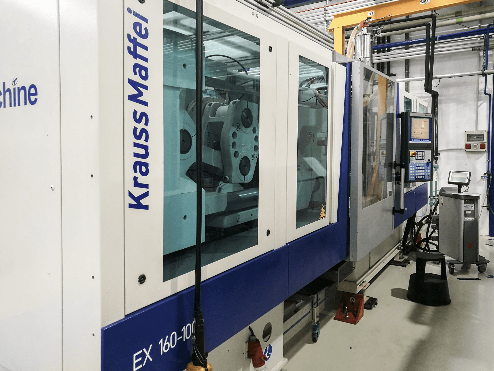 Left view of Krauss Maffei 160-1000 EX Machine
