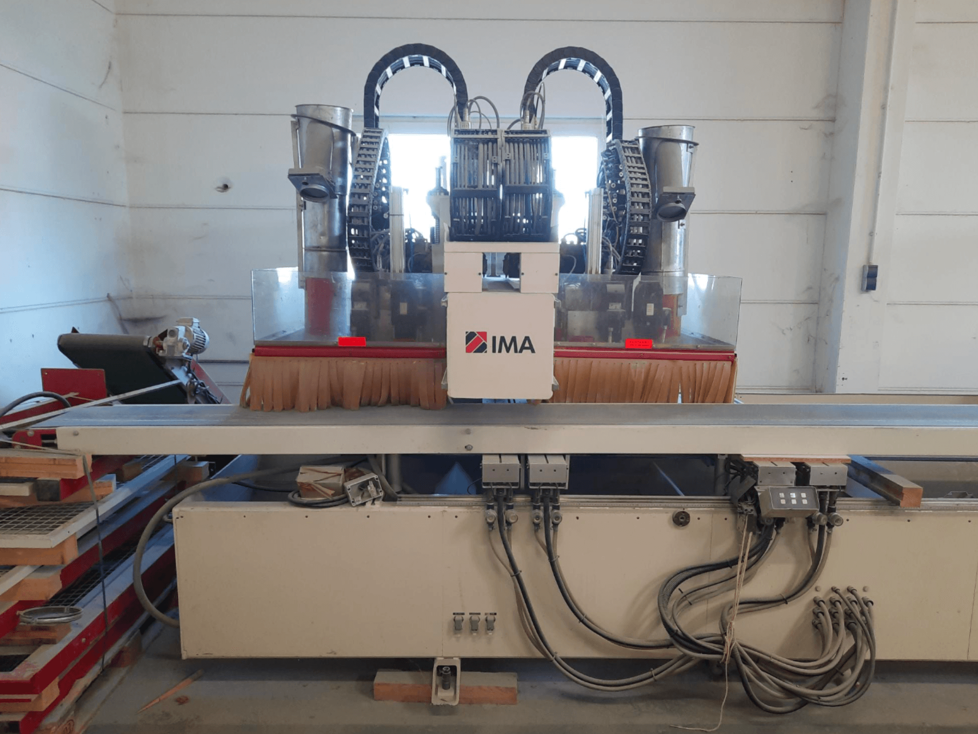 CNC Wood Machining Centre IMA BIMA 610 V shown from the front, featuring brushes, controls, and a worktable.