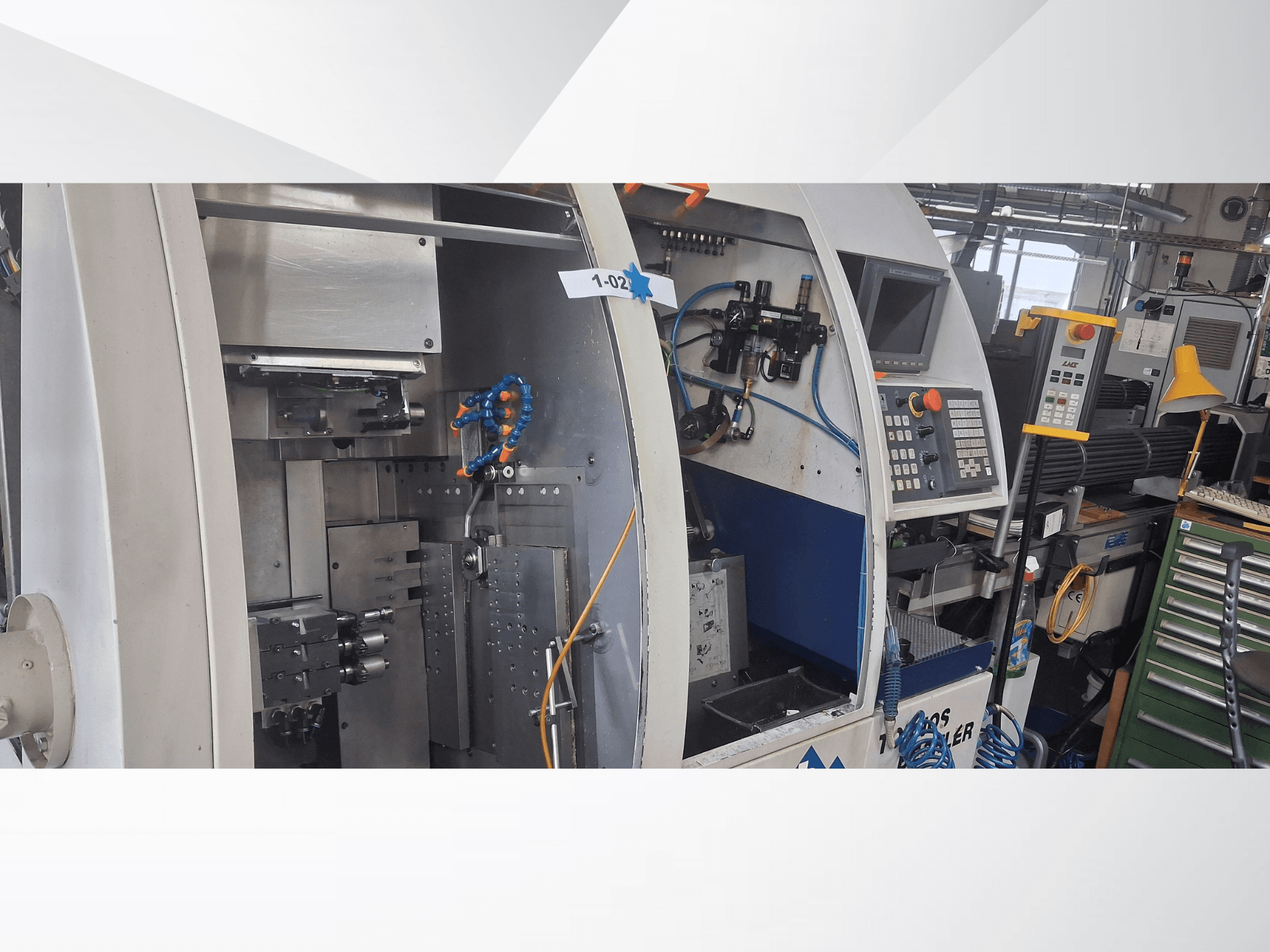 Swiss Type Turning Machine TORNOS DECO 2000-10, front view showing control panel, rotation mechanism, and internal setup.